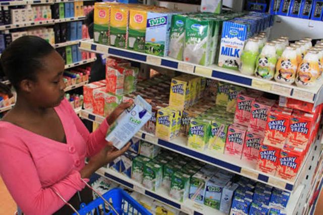 A shopper near the milk section in a Nairobi supermarket: A biting milk shortage against high prices hits Kenya and especially Nairobi region