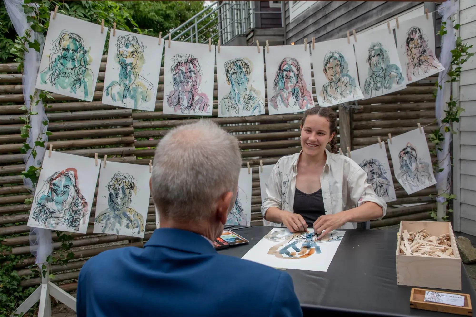 Iris drawing guests at an event