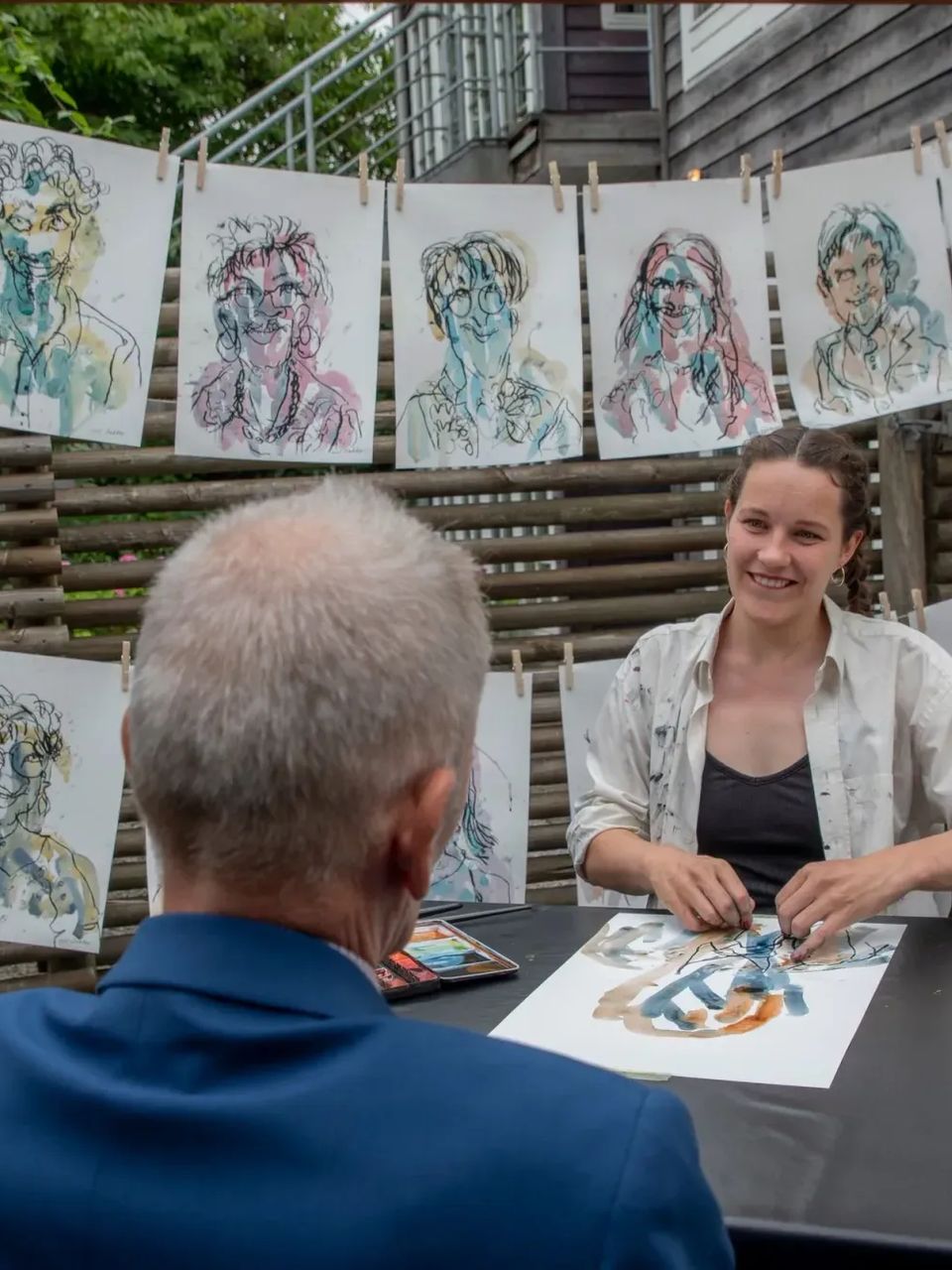 Iris drawing guests at an event
