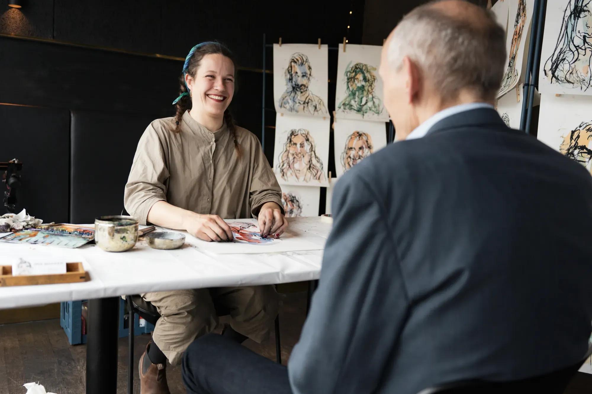 Iris drawing guests at an event