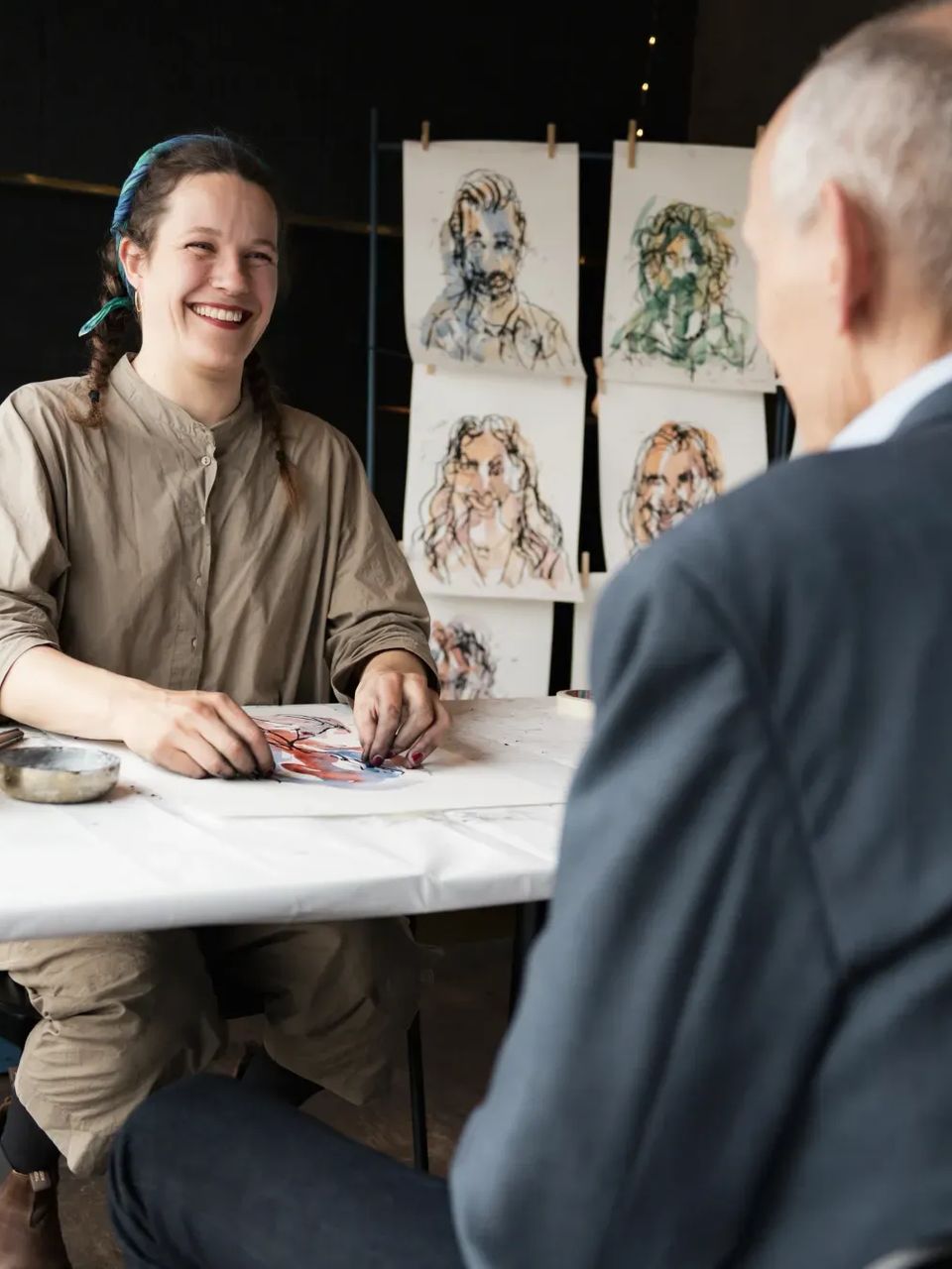 Iris drawing guests at an event