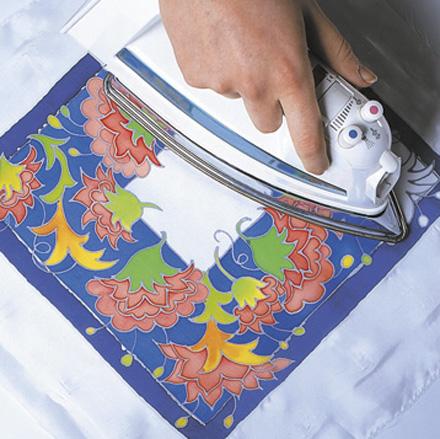 The finished work is ironed to set the color.