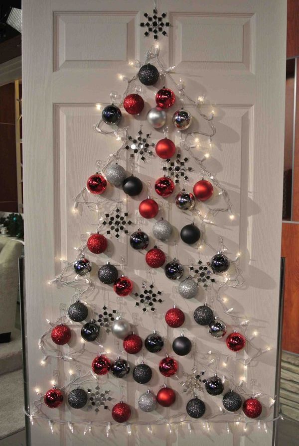 Christmas tree made of lights and globes on the door