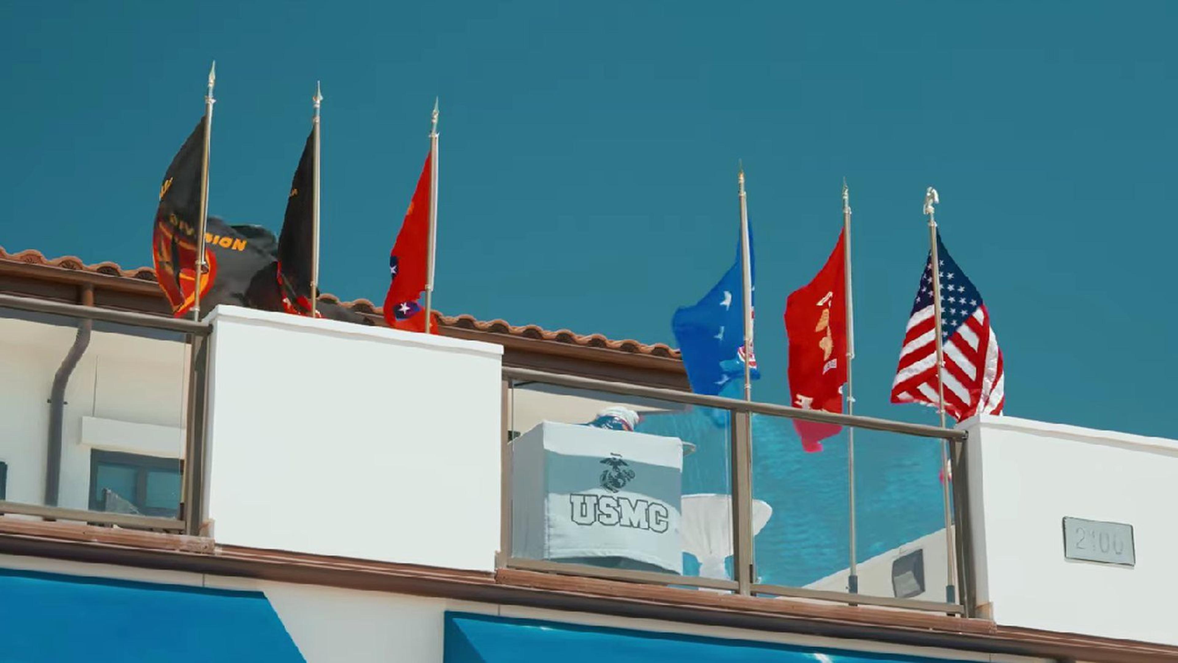 Military and American flags above a Camp Pendleton venue terrace