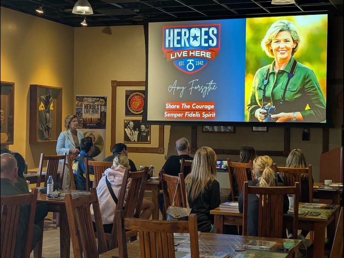 Amy Forsythe speaking to guests seated together at Camp Pendleton