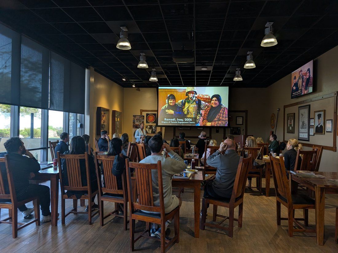 Guests gathered for a presentation during a Camp Pendleton team experience