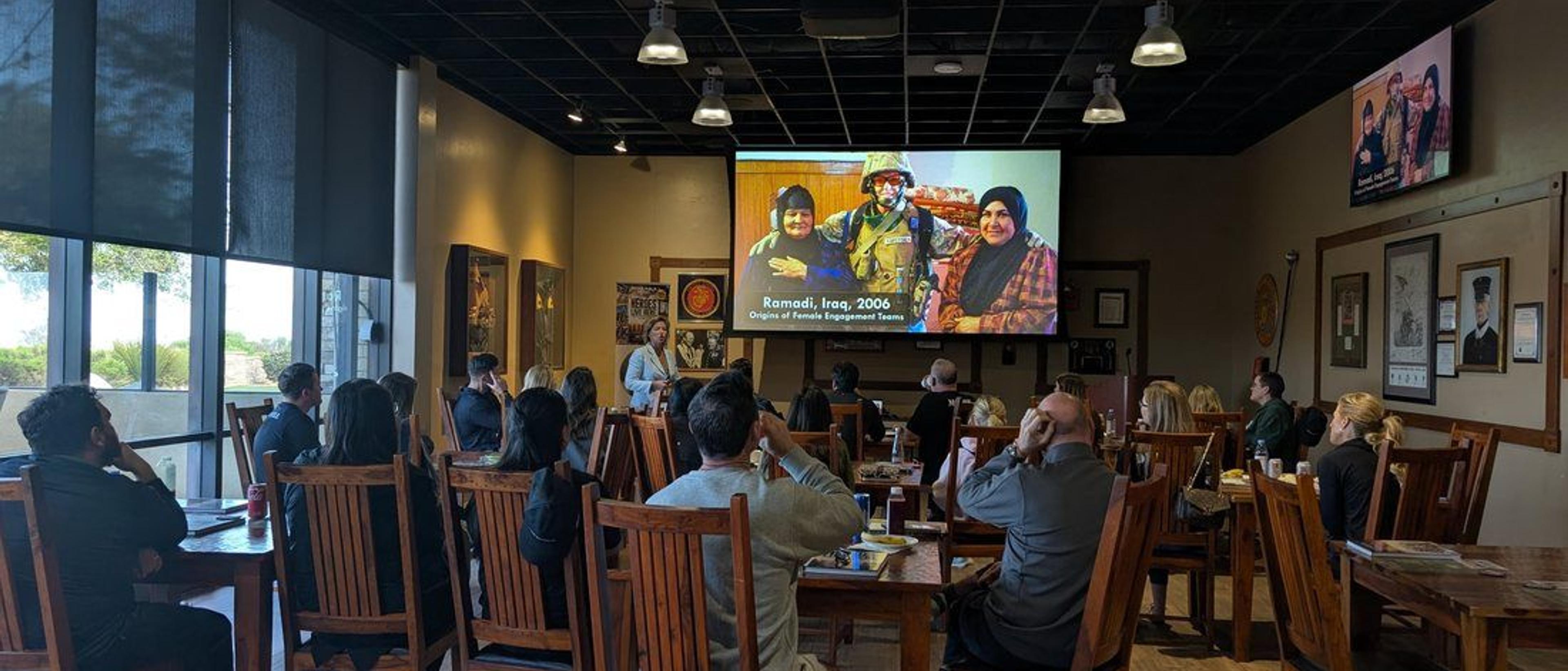 Guests gathered for a presentation during a Camp Pendleton team experience