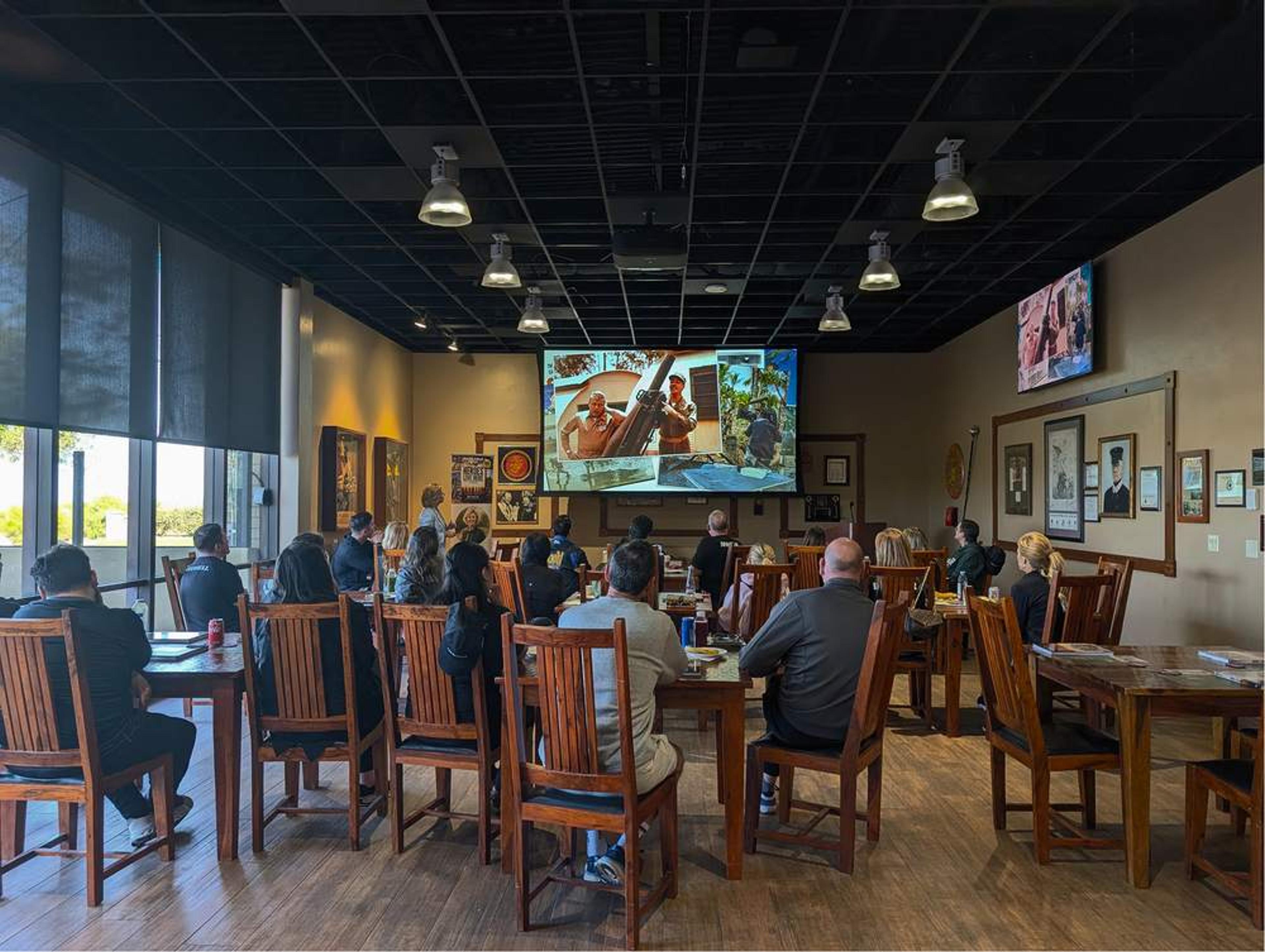 Colleagues share a meal at Iron Mike's during an Experience Camp Pendleton team day