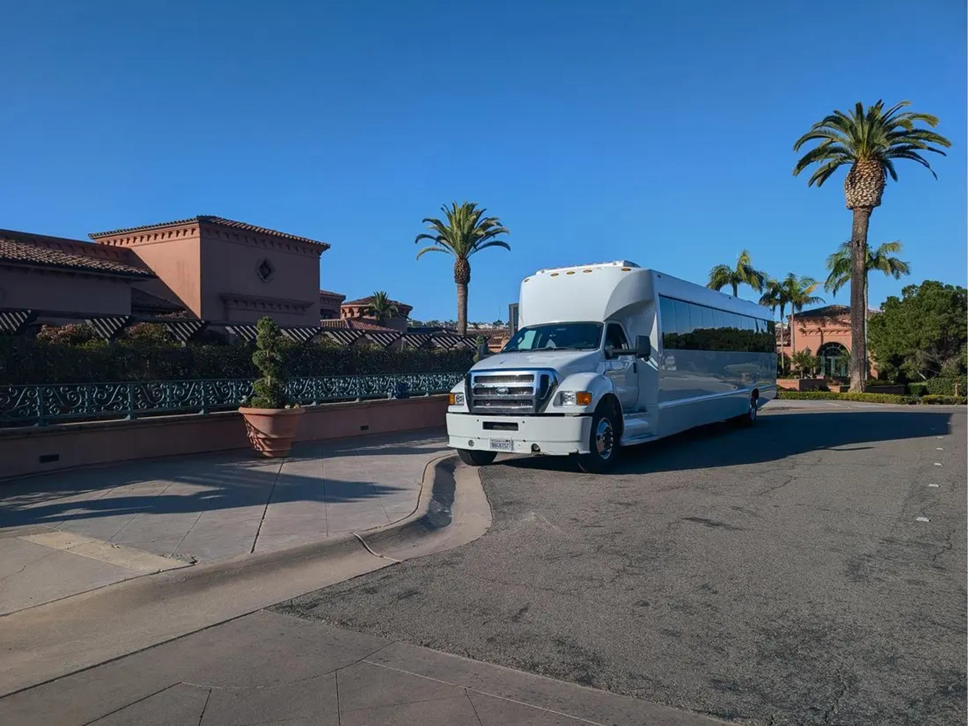 A charter coach waits at a San Diego hotel for an Experience Camp Pendleton group departure