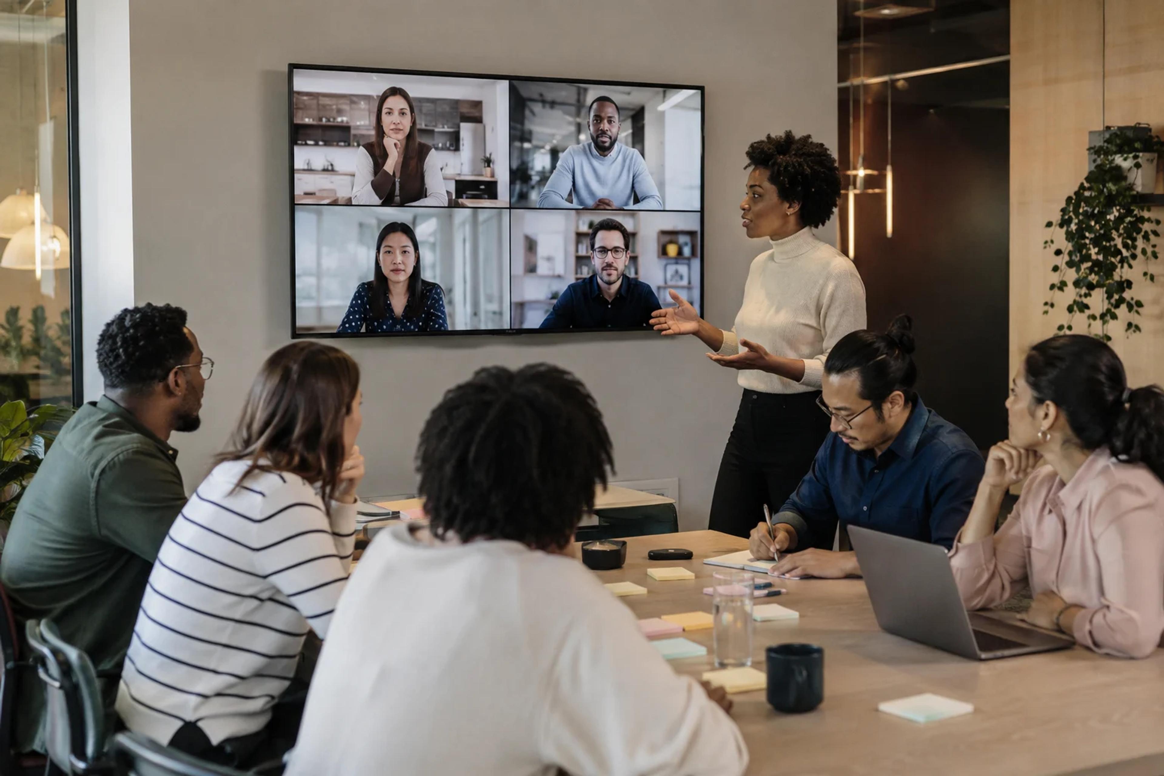 Office-based and remote employees participate equally in a professionally hosted hybrid team event