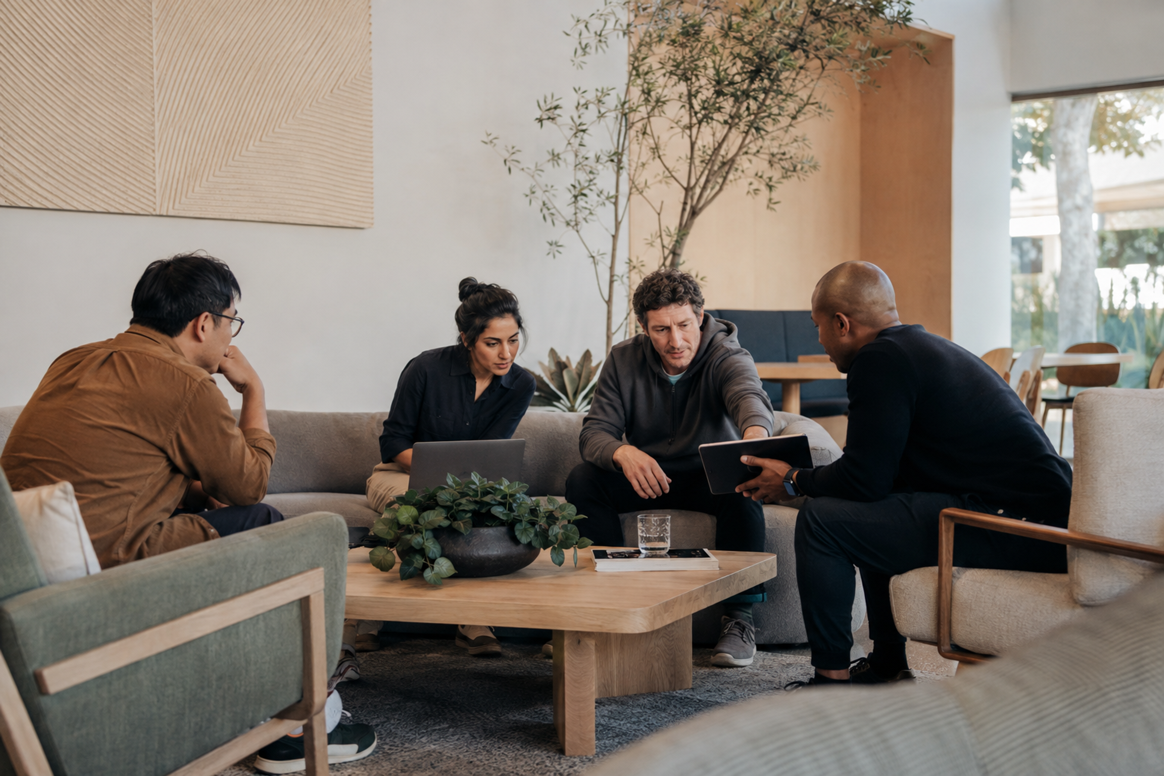 Software startup employees hold a relaxed architecture review in a California workspace