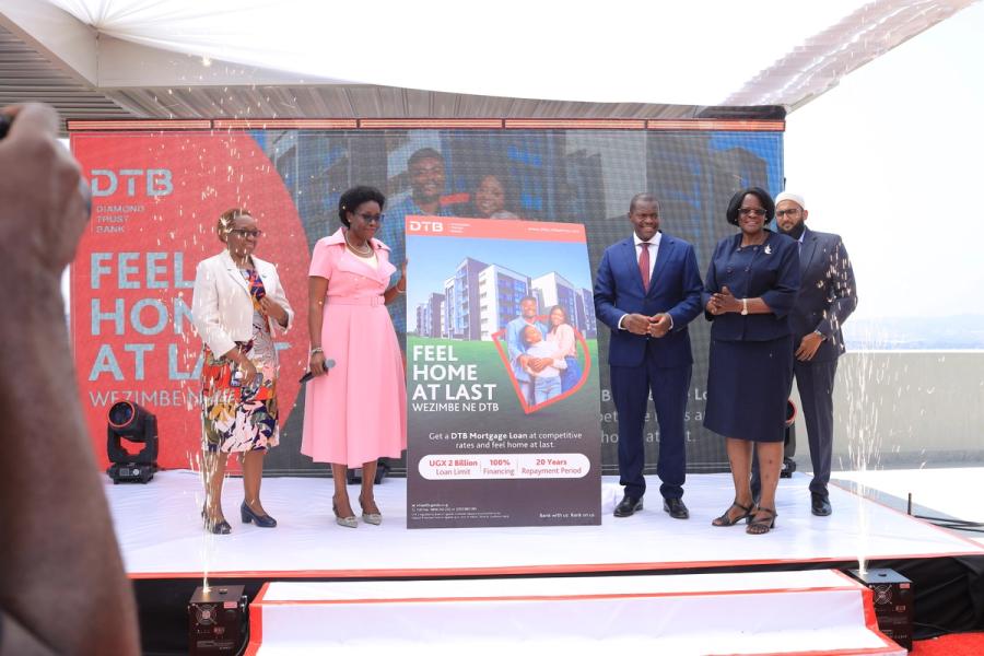 Hon. Ruth Nankabirwa, the Minister for Lands, Housing and Urban Development (1st left), officially launches the DTB Mortgage Financing. Looking on are Godfrey Sebaana, CEO of DTB Uganda, DTB Board members and Property Developers.