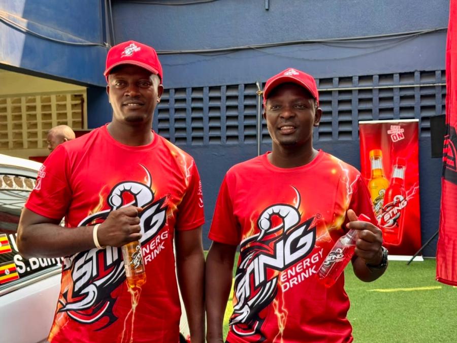 Ugandan rally driver Umar Dauda (L) with his co-driver
