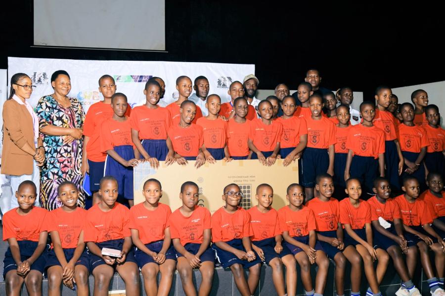 Pupils from Gayaza Junior School pose for a photo with the event partners and organisers after being awarded with a full solar panel system for being one of the overral winners in the tournament