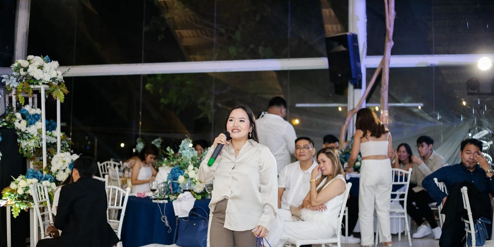 A speaker addressing guests at a corporate event in the Philippines