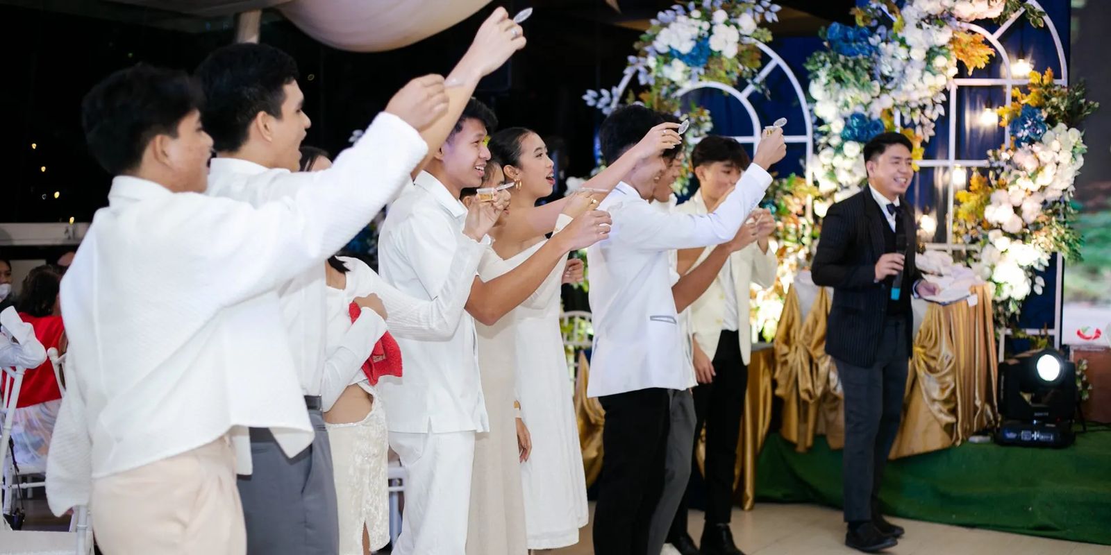 Wedding host addressing guests at a Philippine wedding reception