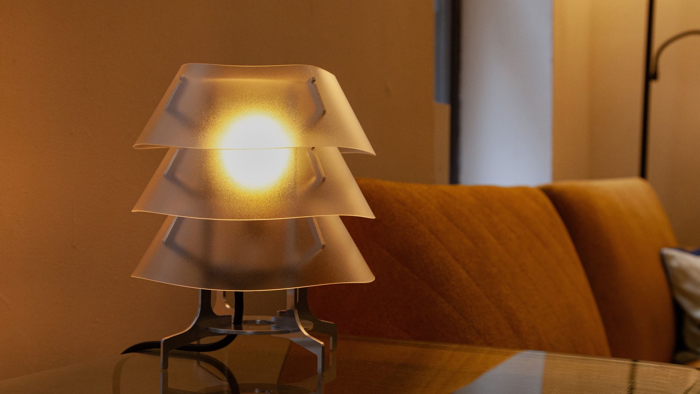 Aluminum and polycarbonate lamp in living room. 