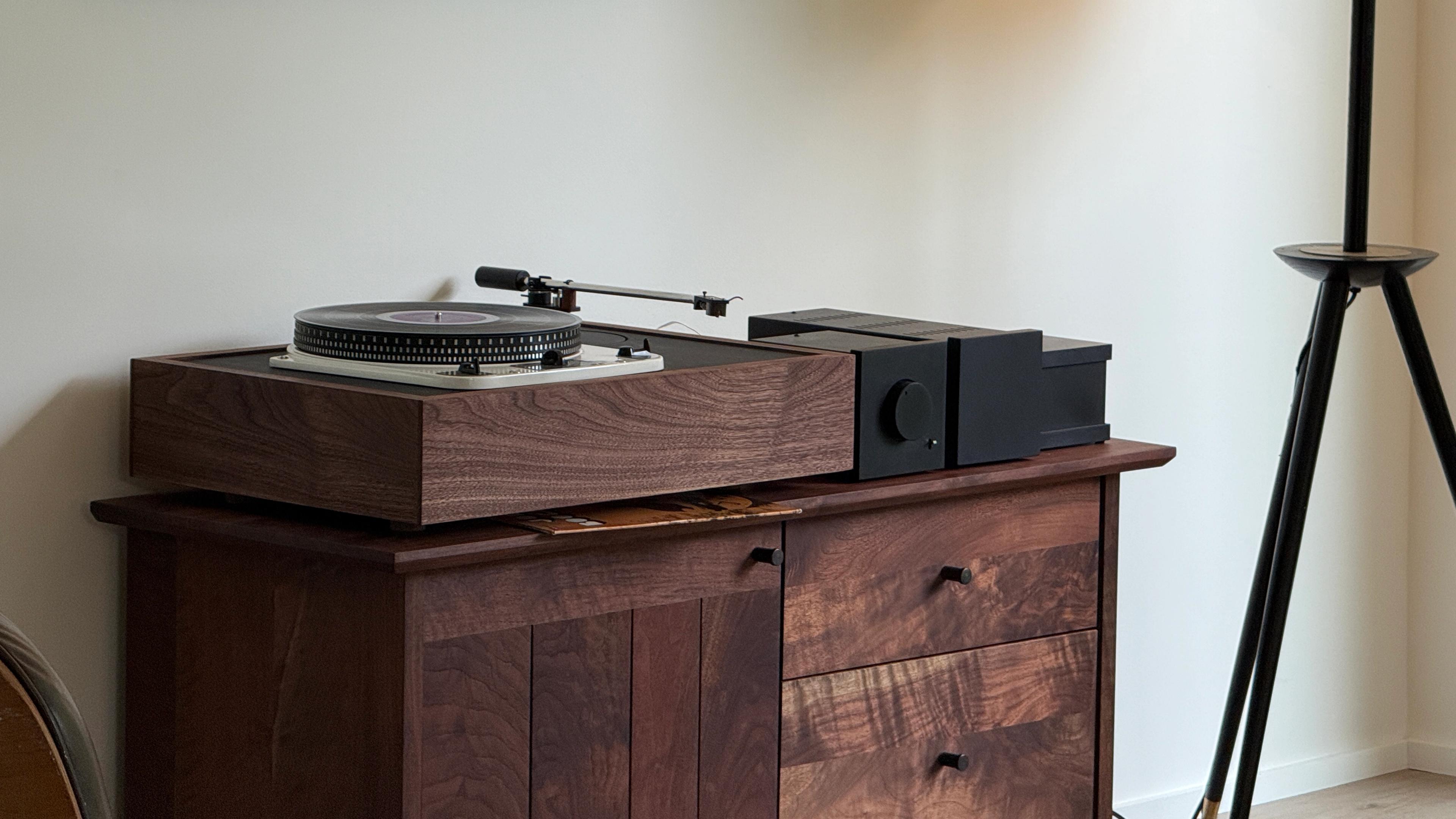 Turntable and black hifi gear with mid-century modern furniture.
