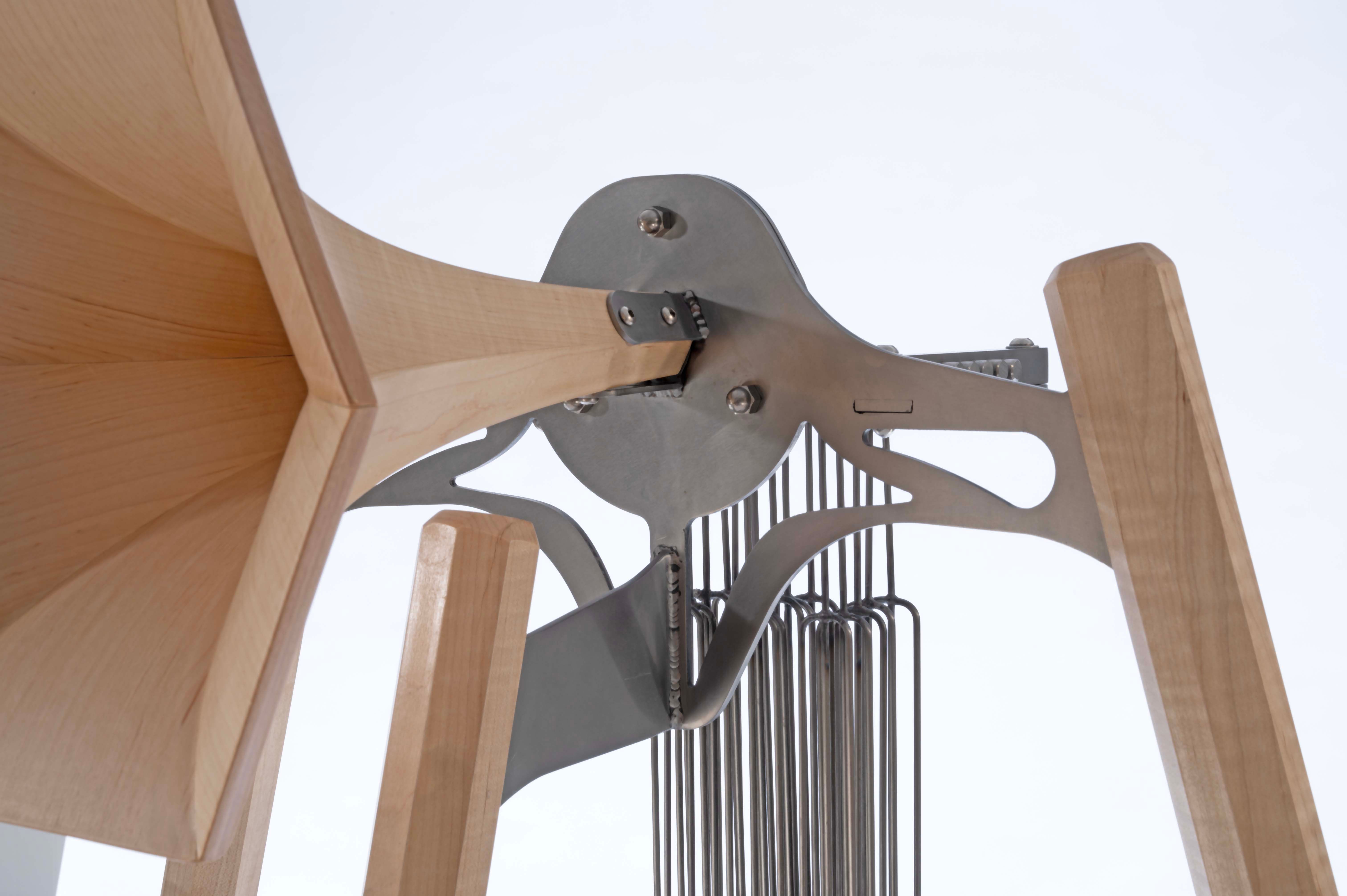 Steel and maple horn sculpture with chimes. 