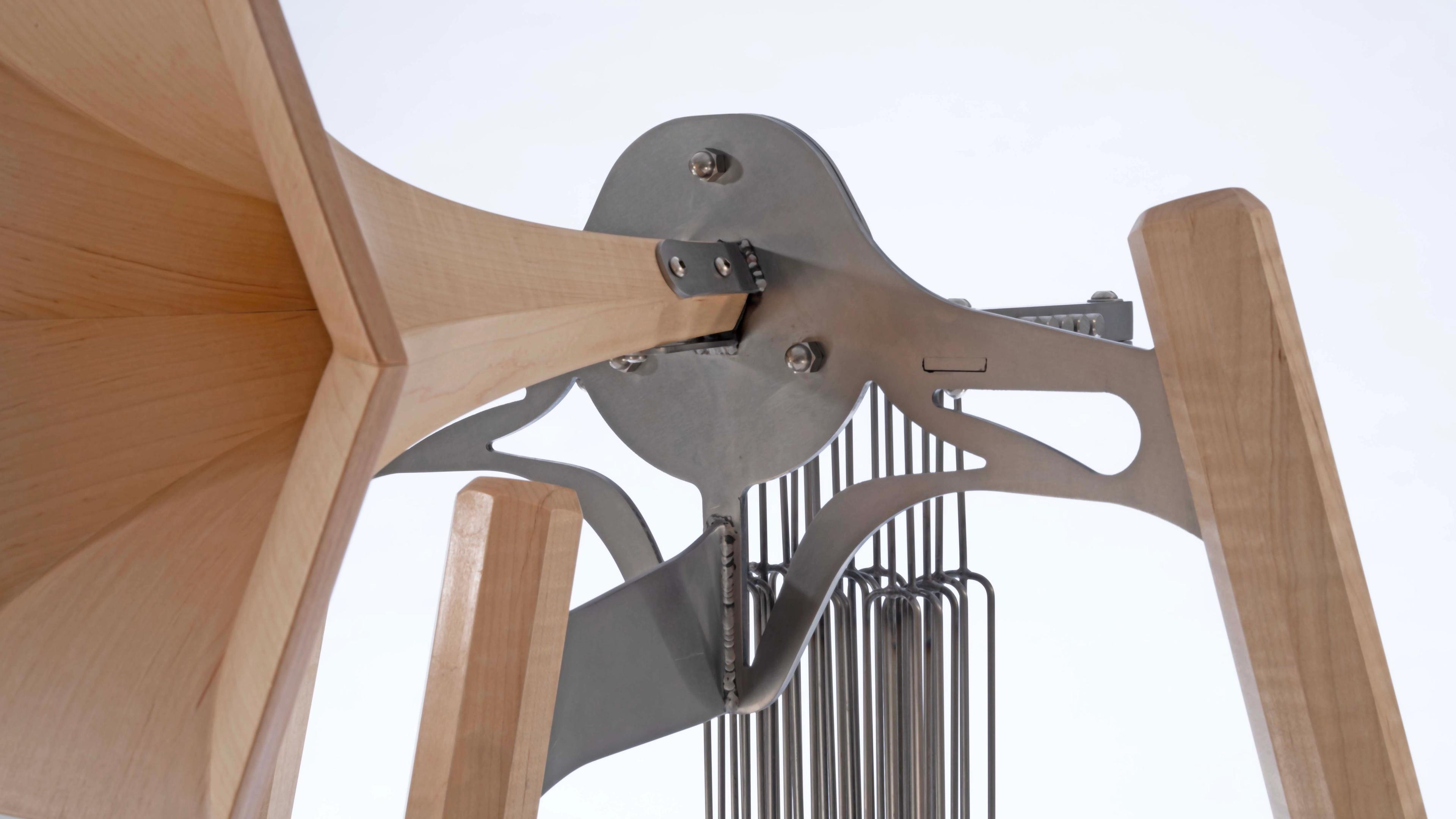 Steel and maple horn sculpture with chimes.