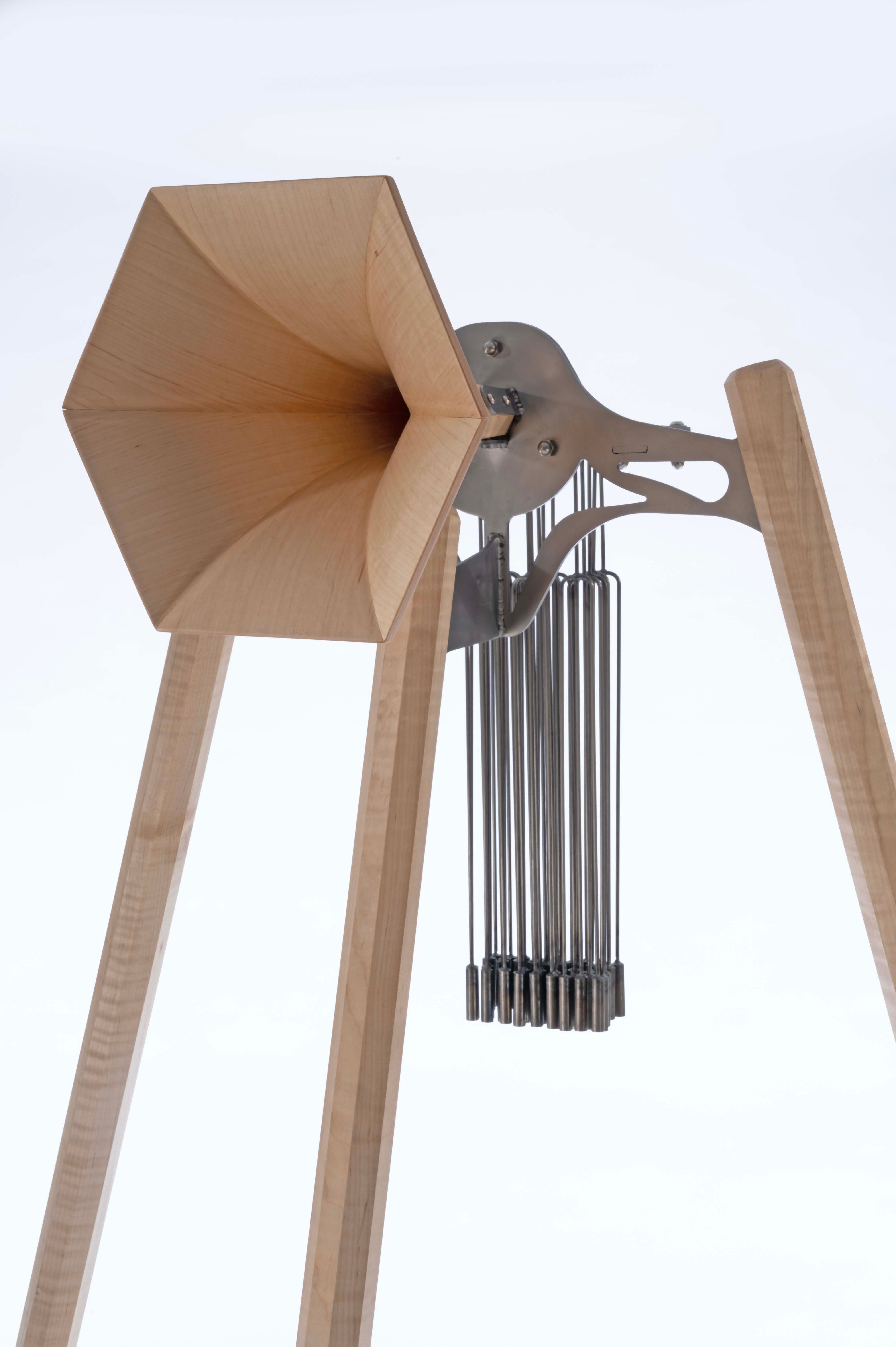 Steel and maple horn sculpture with chimes. 