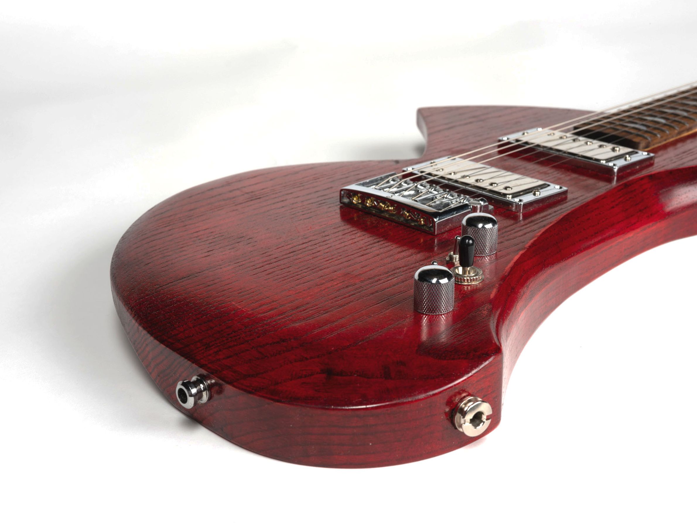Red guitar with maple neck