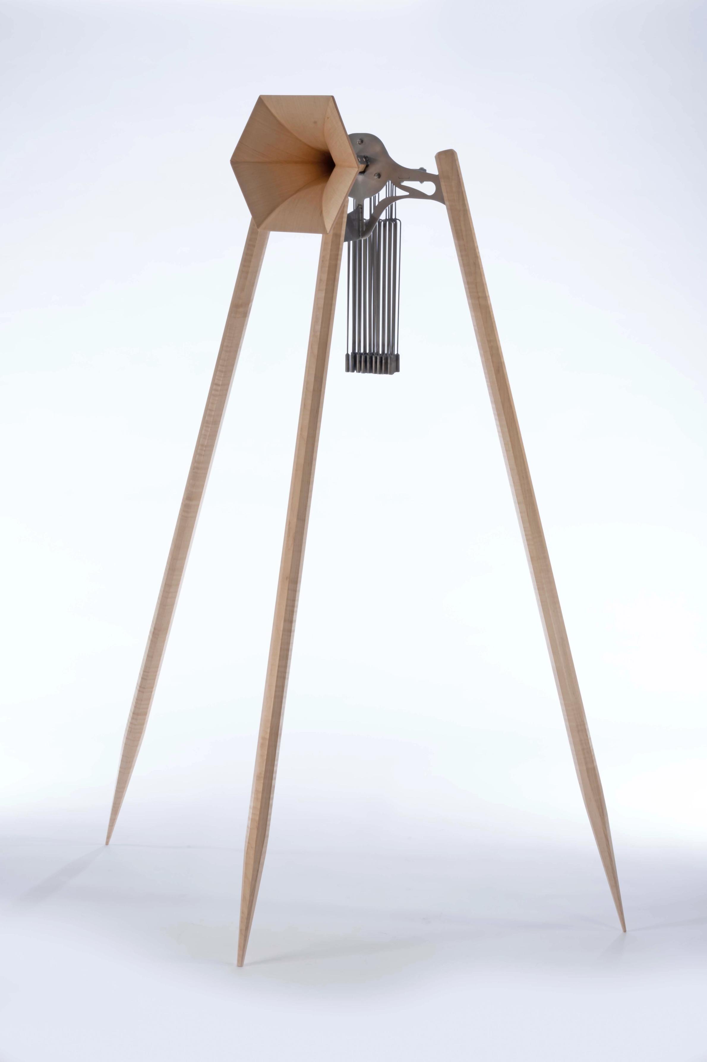 Steel and maple horn sculpture with chimes. 