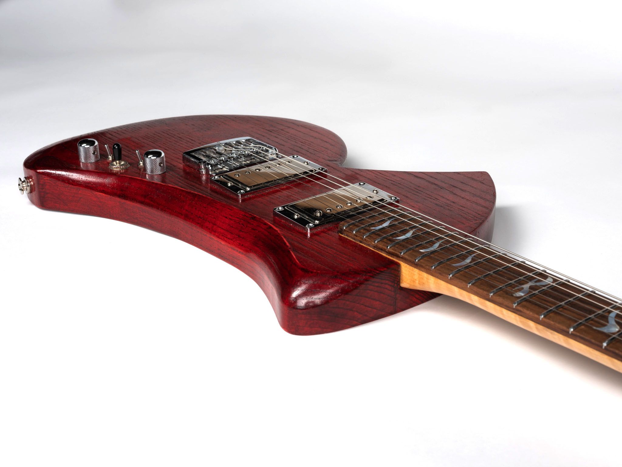 Red guitar with maple neck