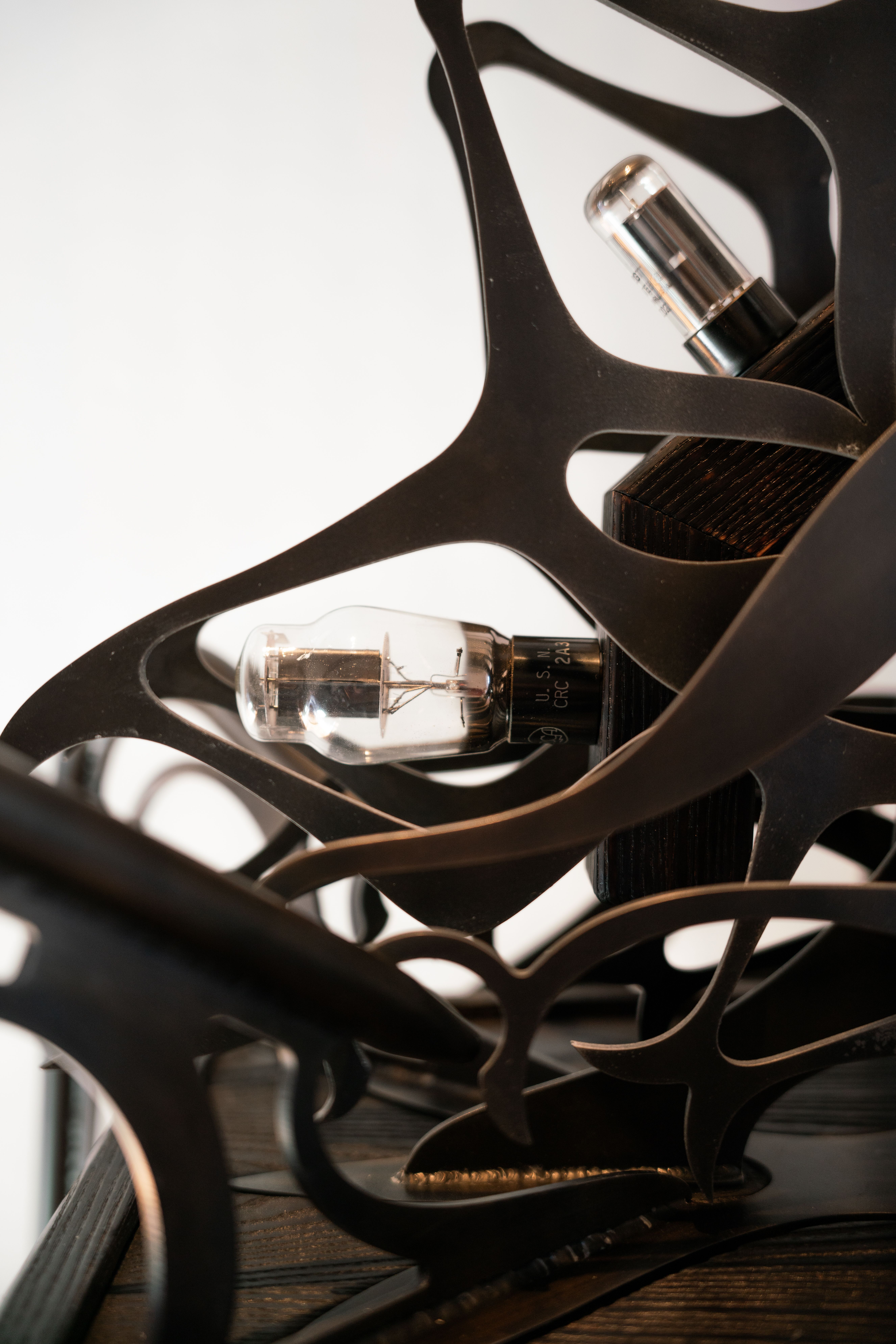 Ornamental blackened steel amplifier with tubes.