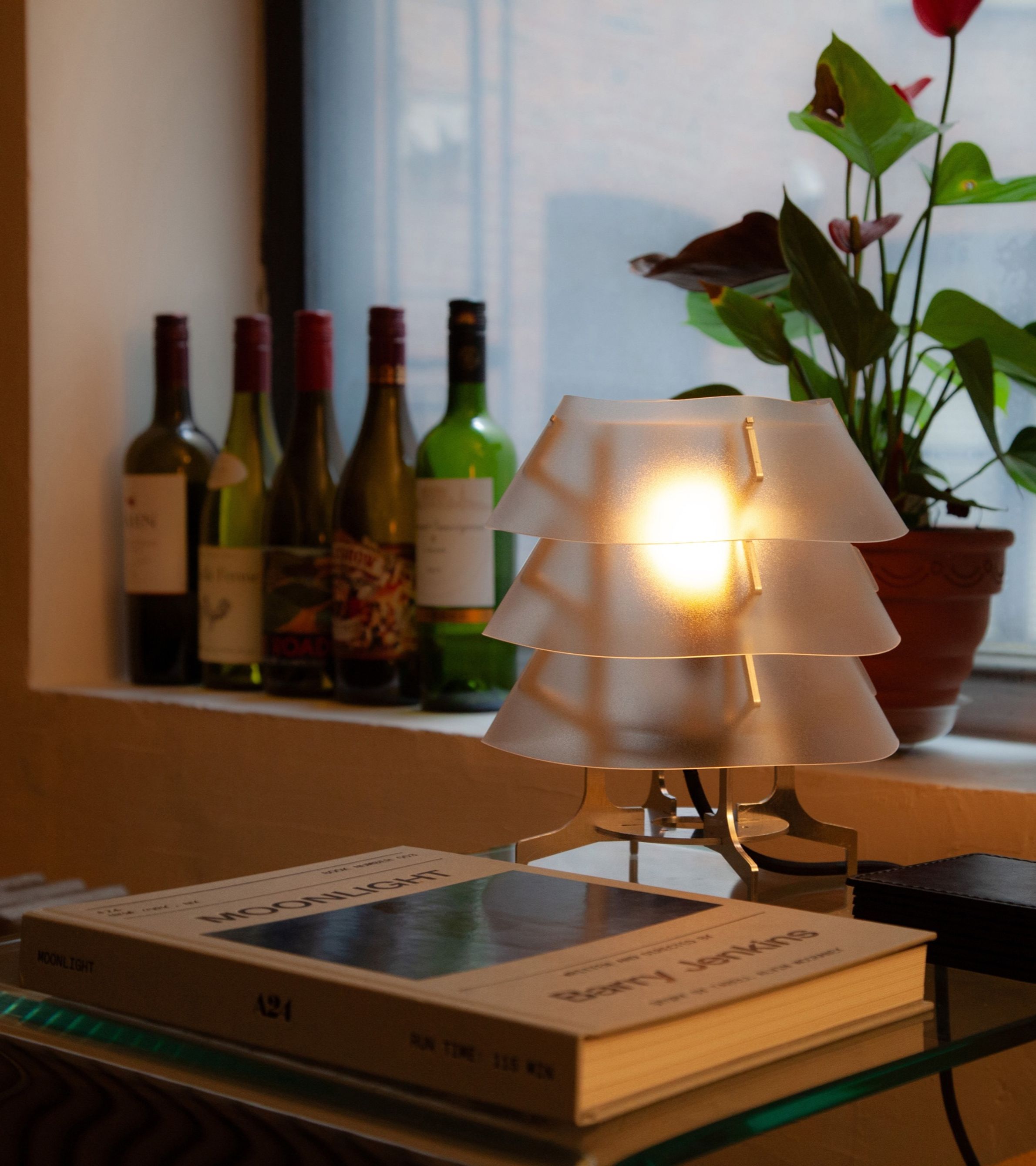 Aluminum and polycarbonate lamp in living room. 