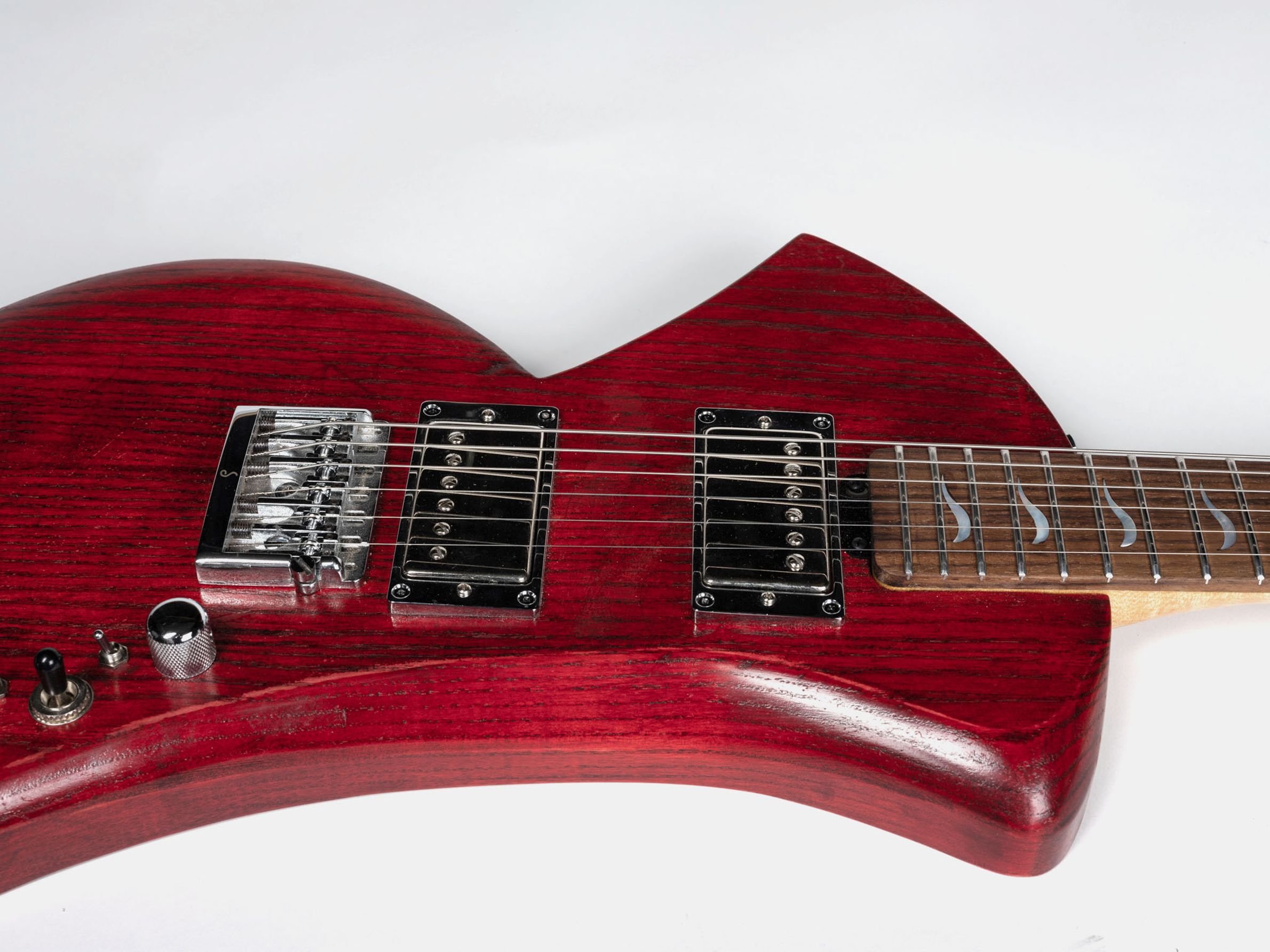 Red guitar with maple neck