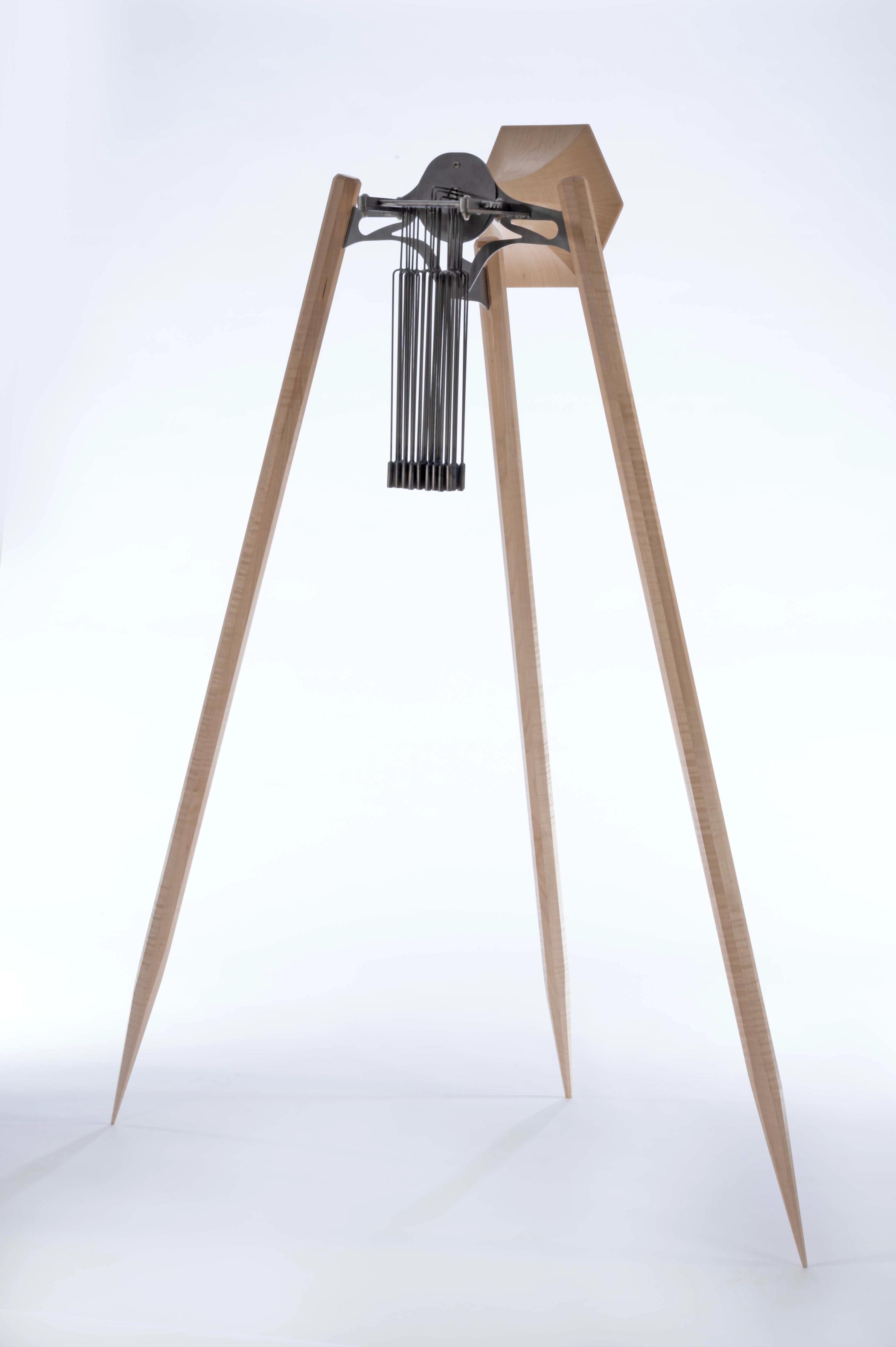 Steel and maple horn sculpture with chimes. 