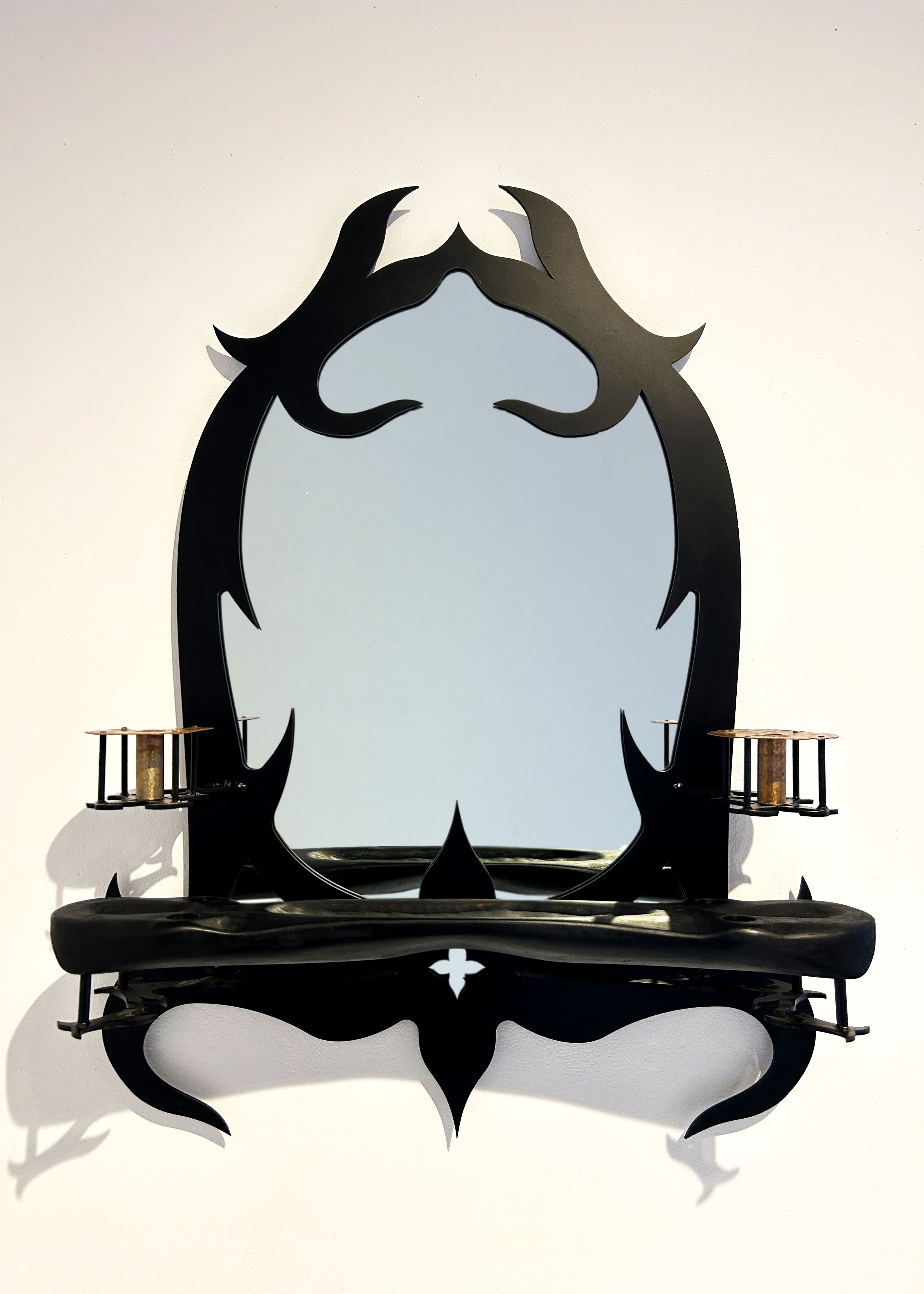 Blackened steel mirror