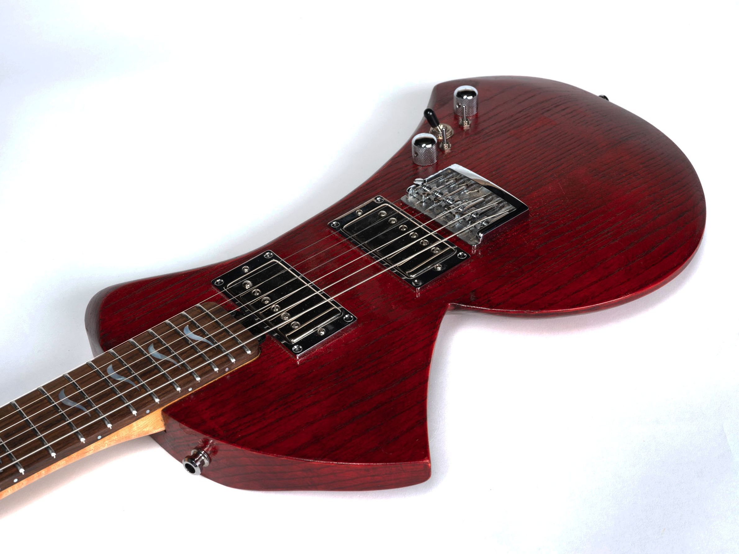 Red guitar with maple neck