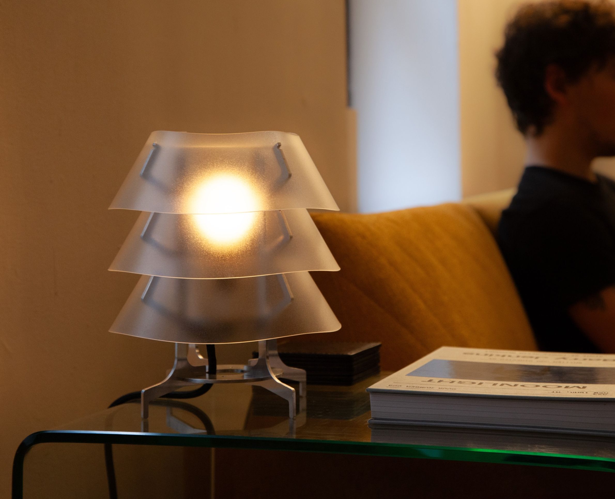 Aluminum and polycarbonate lamp in living room. 