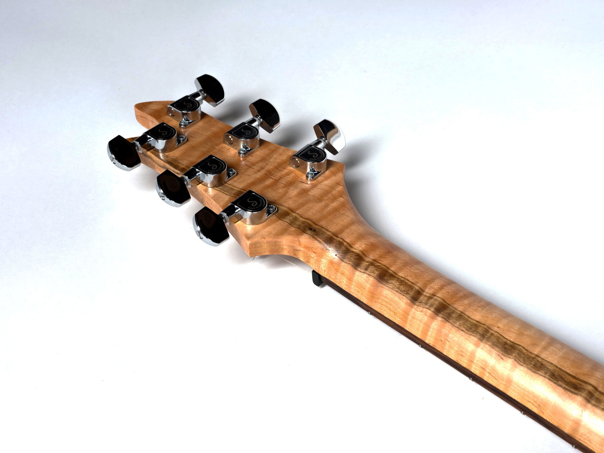 Red guitar with maple neck