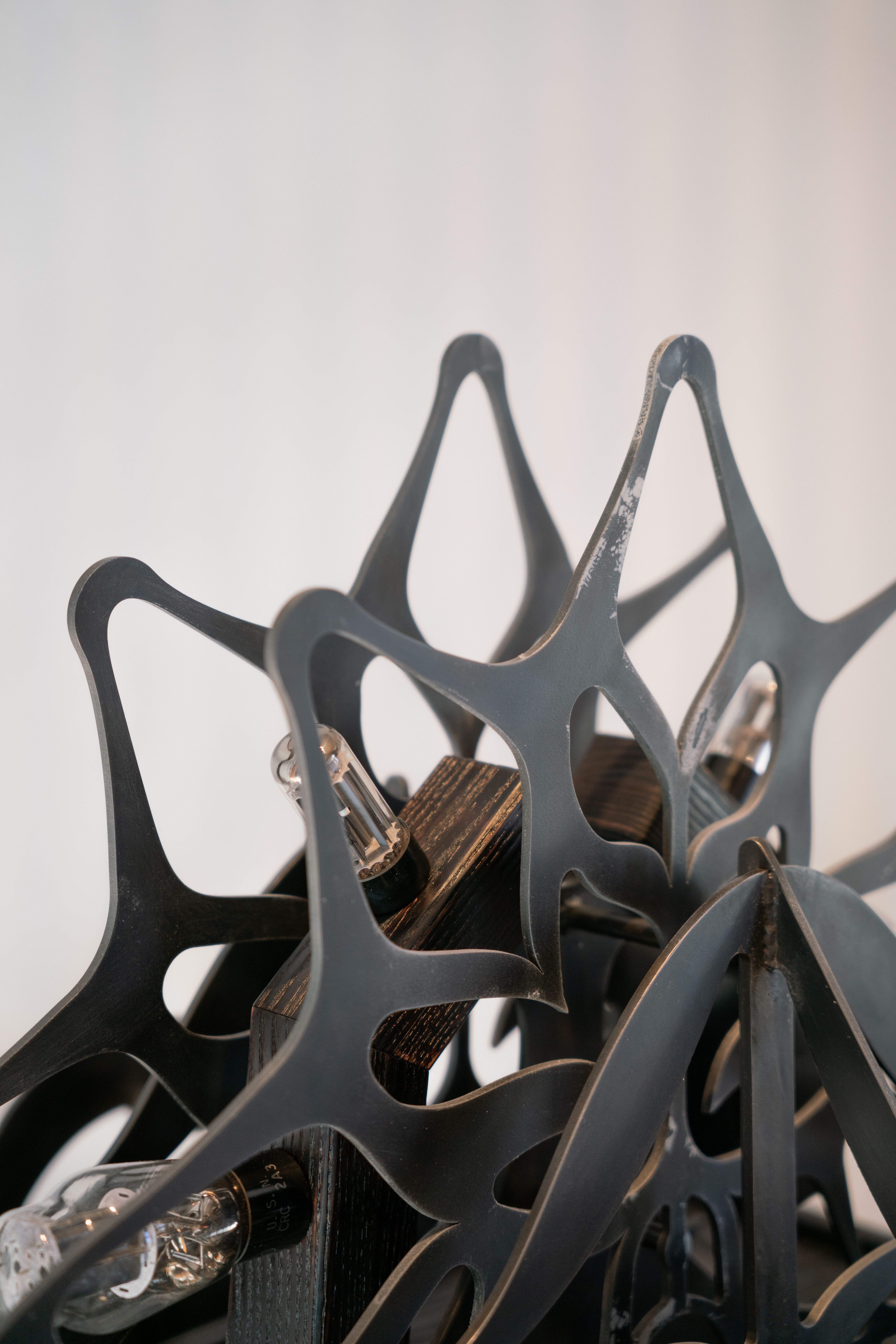 Ornamental blackened steel amplifier with tubes.