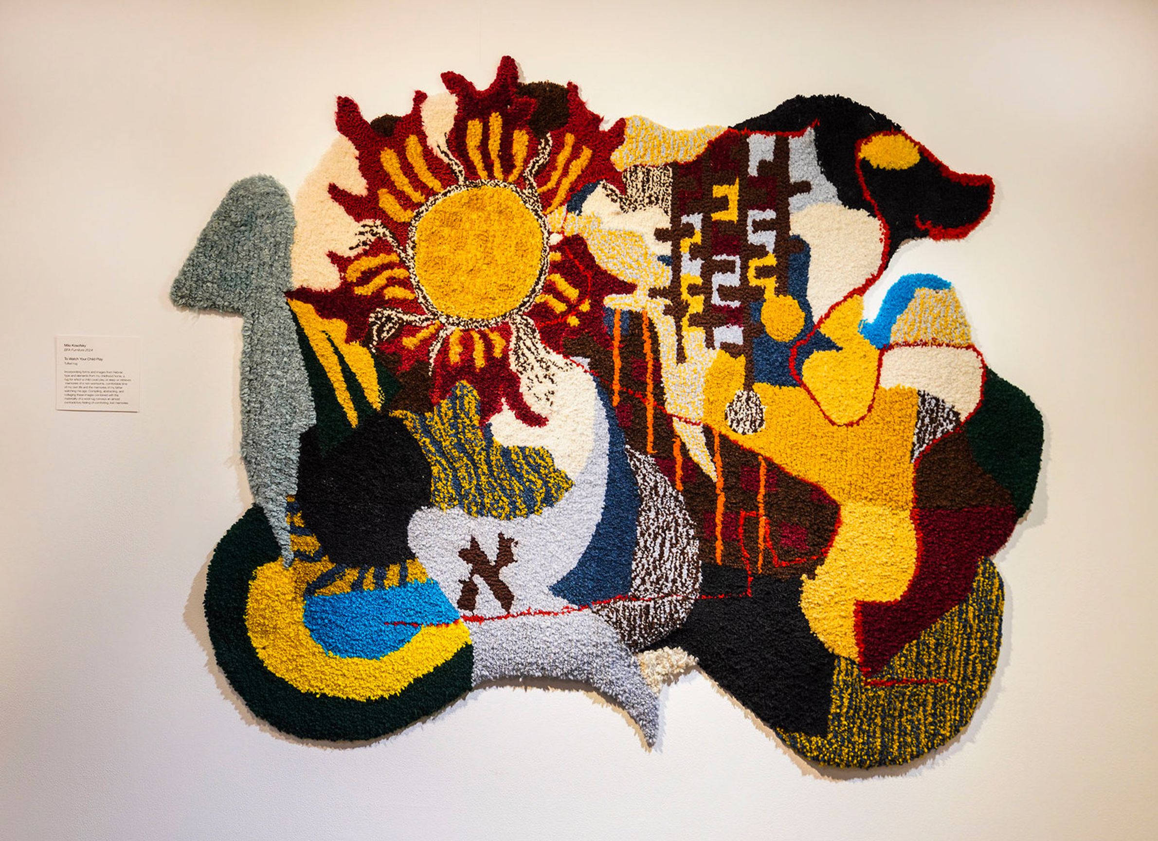 Colorful rug hung on the wall. 