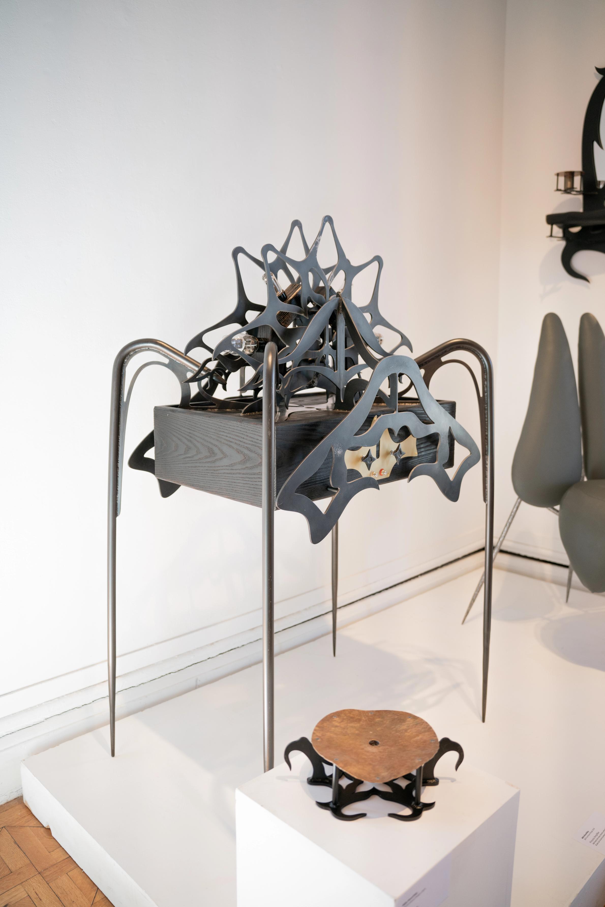 Ornamental blackened steel amplifier with tubes.