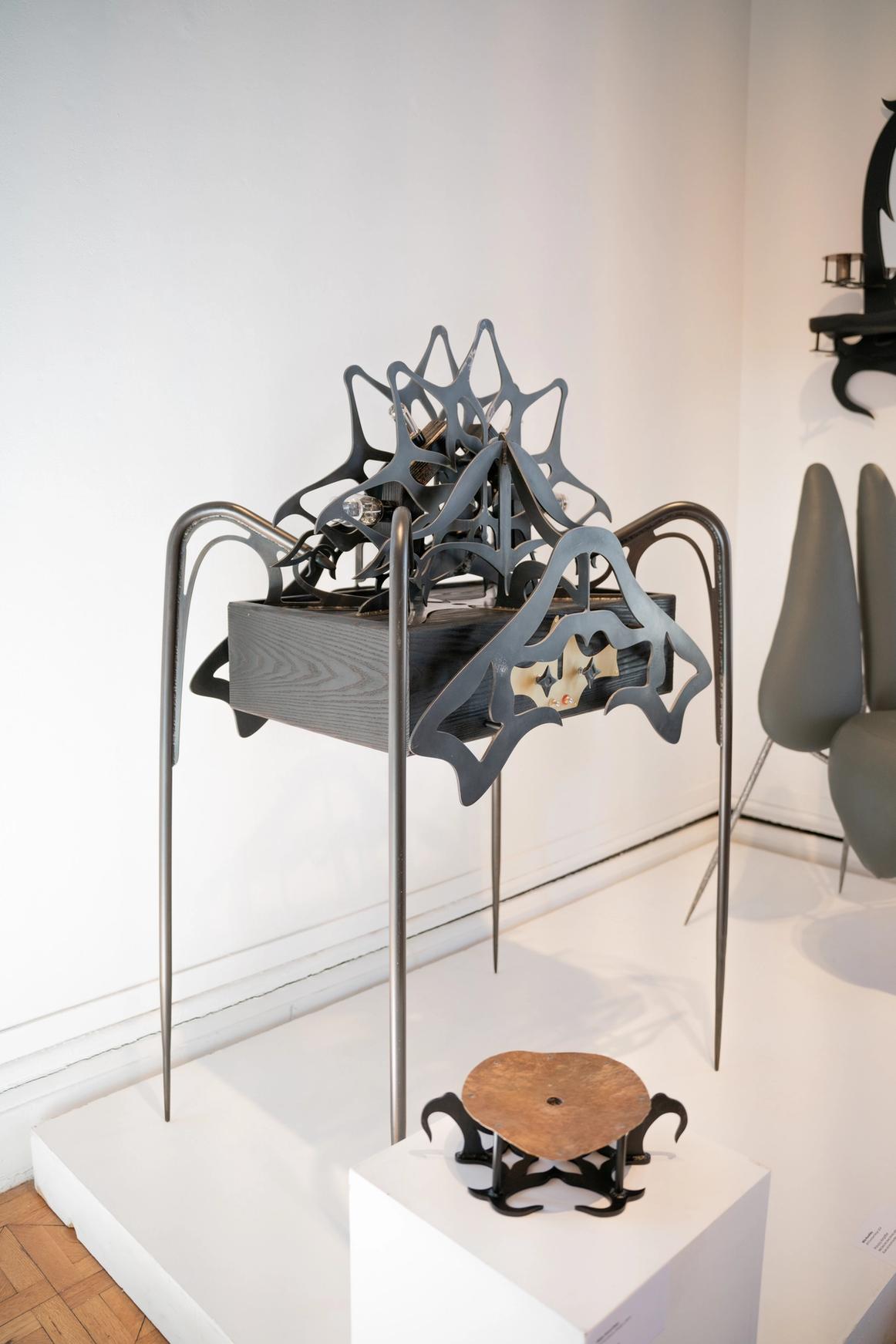 Ornamental blackened steel amplifier with tubes.