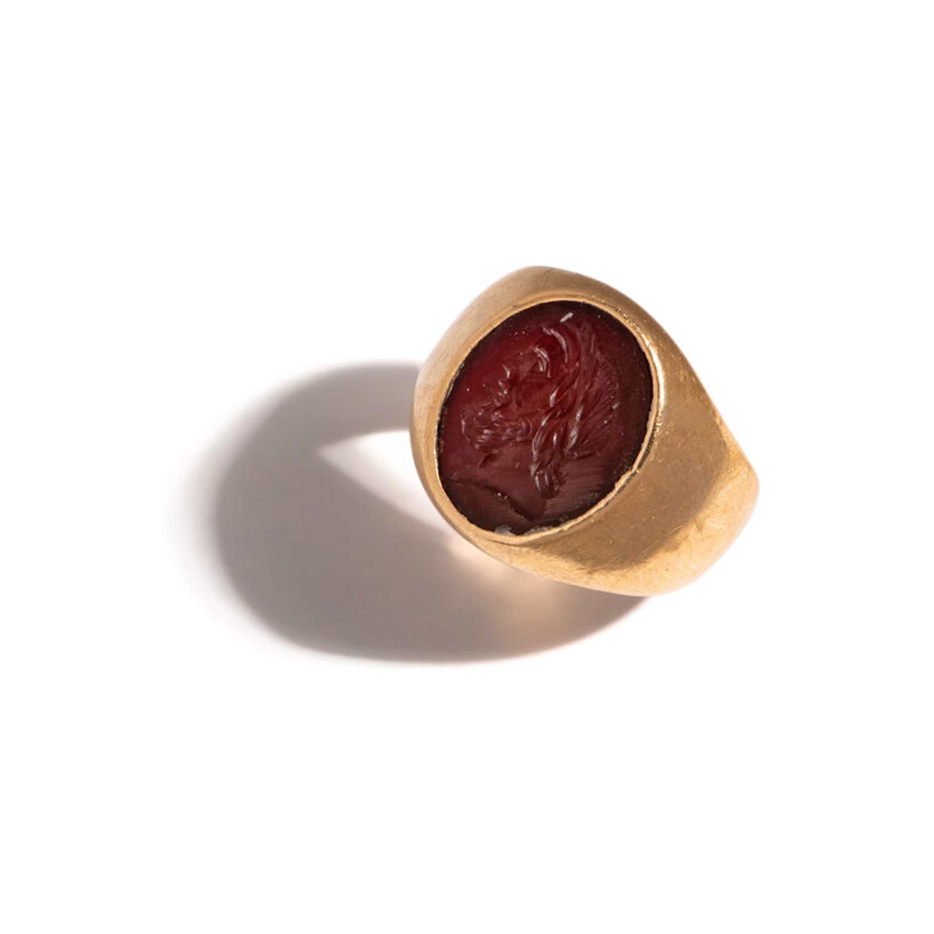 Lot 132 | A Roman Carnelian Ringstone with Jupiter | Estimate: $800 - 1,200