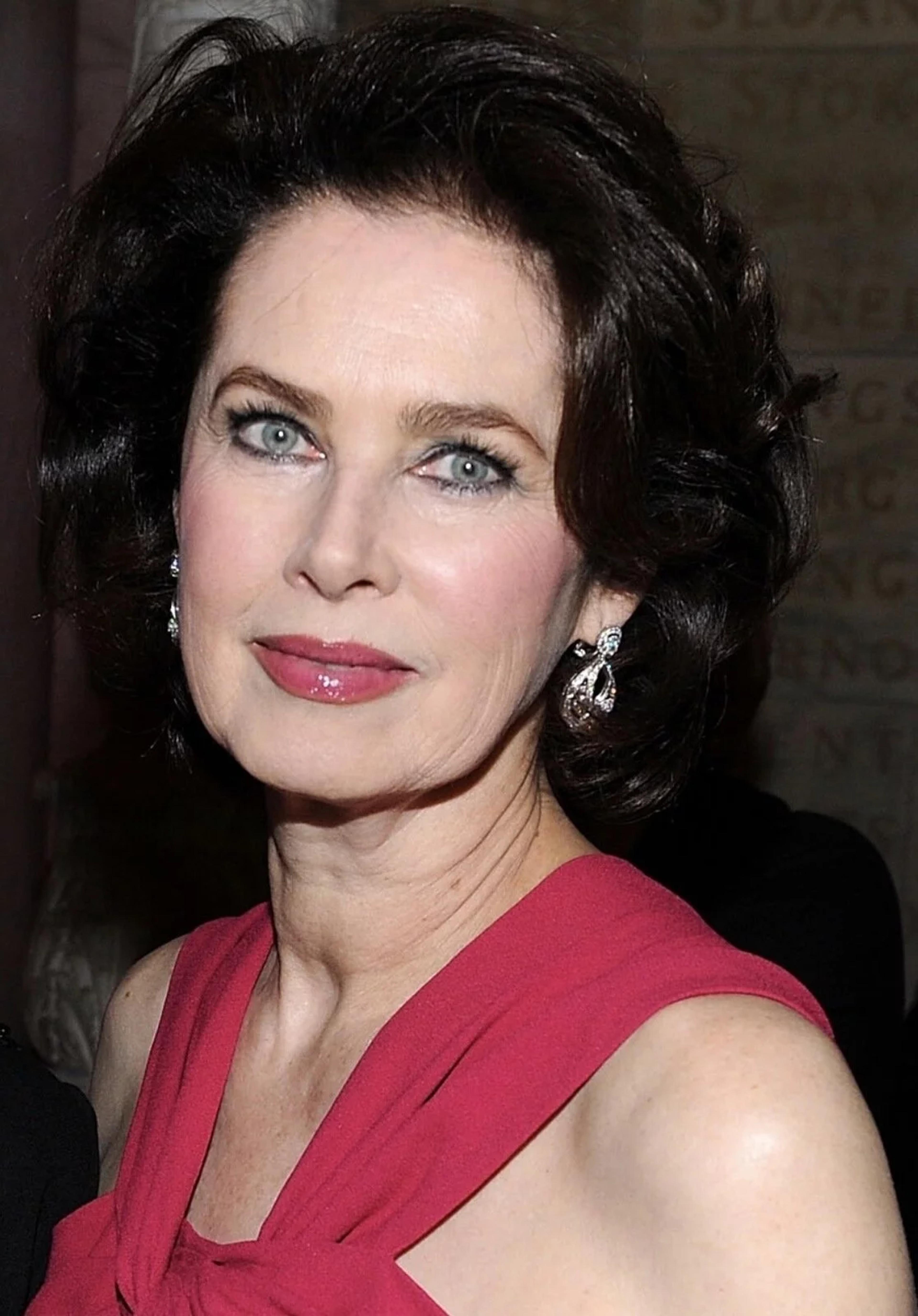 Dayle Haddon wearing the Van Cleef & Arpels ‘Snowflake’ Earrings and Christian Dior, Draped Fuchsia Dress in 2010