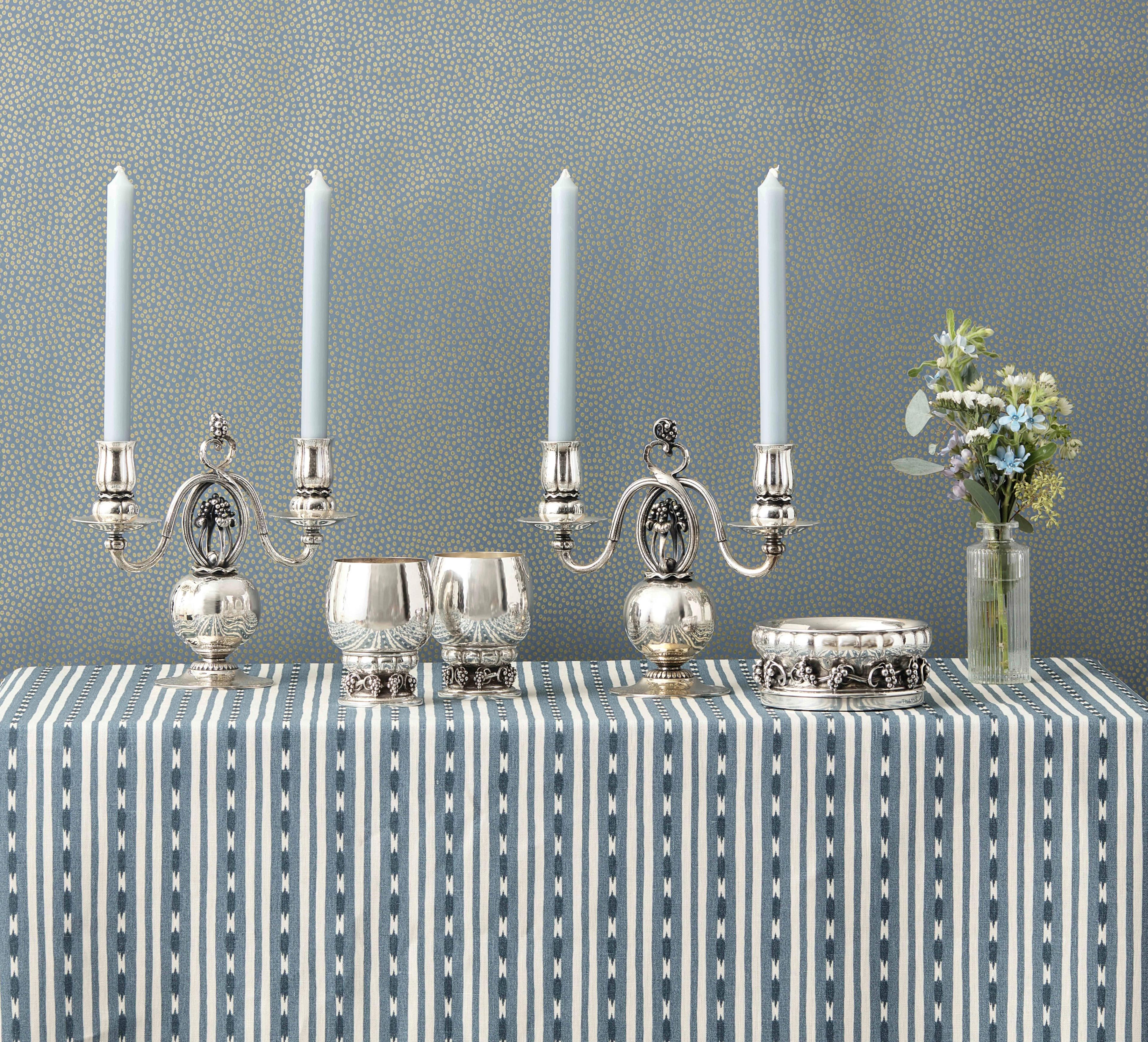 From left to right:
Lot 25 | A Pair of Georg Jensen Silver Two-Light Candelabra | Estimate: $10,000 - 20,000
Lot 53 | A Set of Twelve Georg Jensen Silver Grapevine Goblets | Estimate $8,000 – 12,000
Lot 54 | A Georg Jensen Silver Grapevine Pattern Coaster | Estimate: $4,000 - 6,000