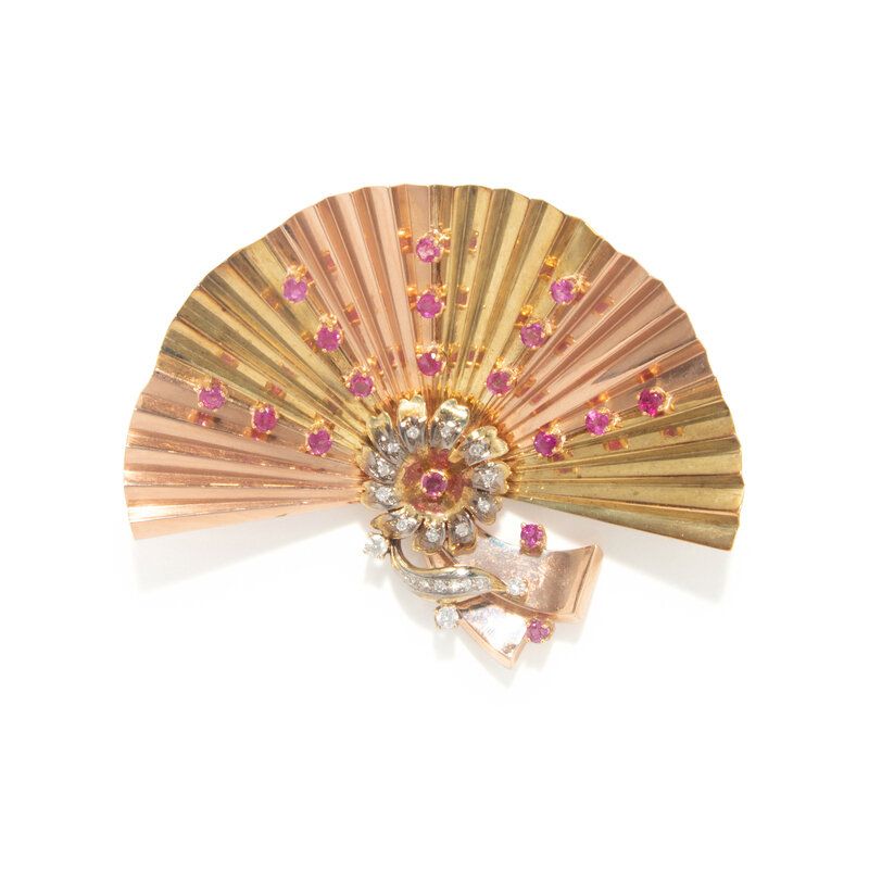 Lot 120 | RETRO, TRICOLOR GOLD, RUBY, AND DIAMOND FAN BROOCH | Estimate: $1,500 - 2,000