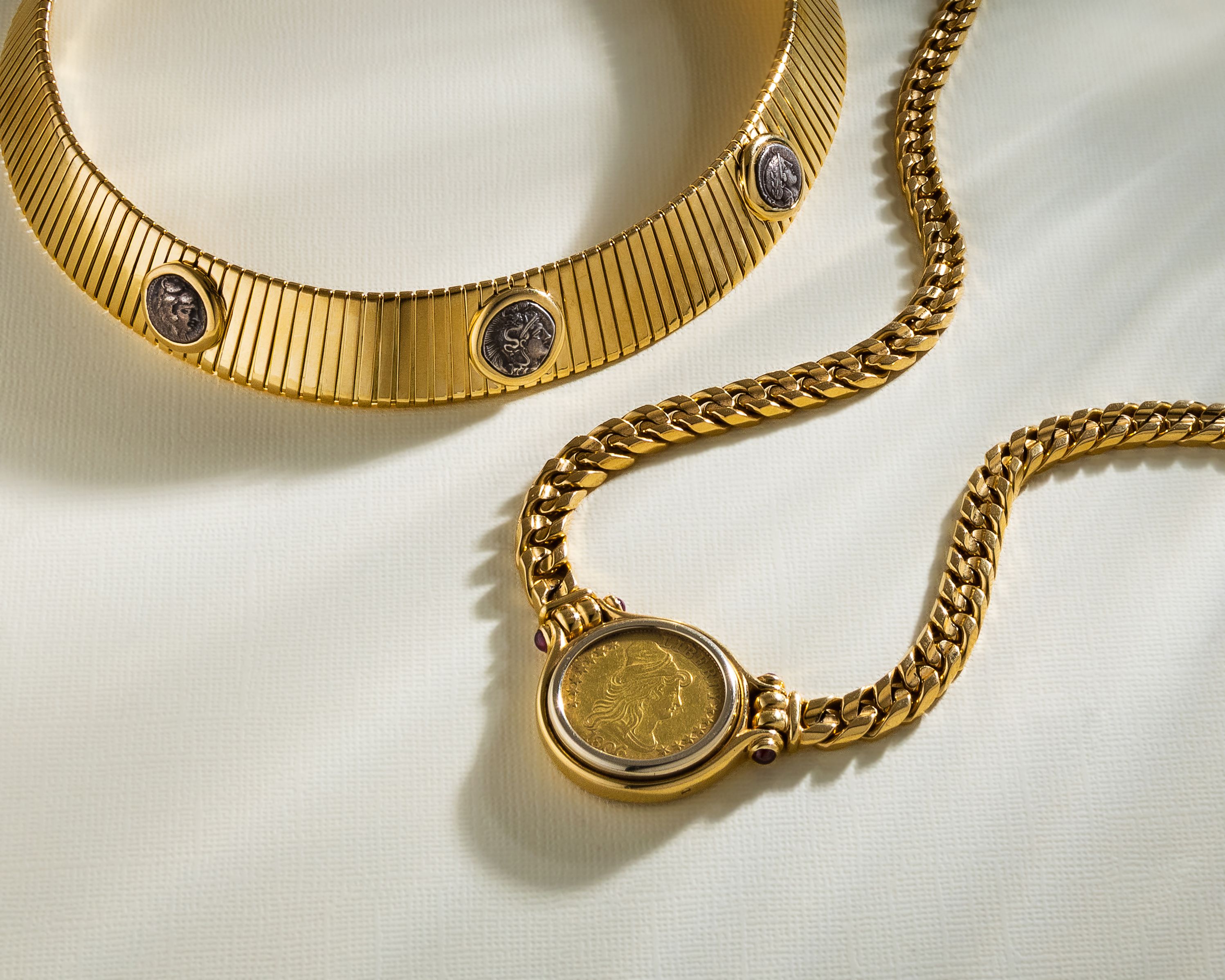 A gold necklace and braceletAI-generated content may be incorrect.
