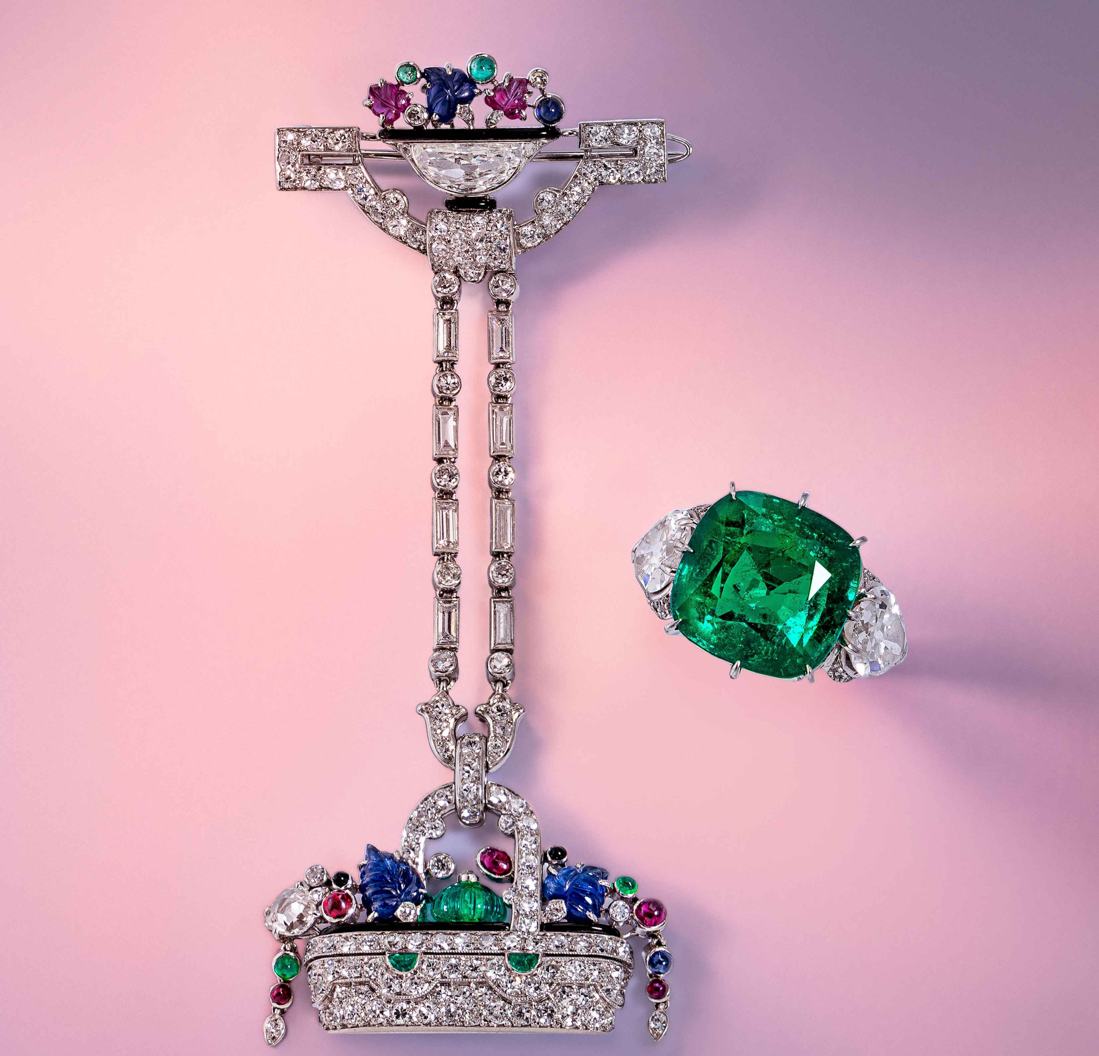 Lot 20 | Lacloche Frères, Art Deco, Diamond, Ruby, Emerald, and Sapphire Lapel Watch | Sold for $57,600 Lot 112 | Colombian Emerald, Diamond, and Platinum Ring | Sold for $128,000