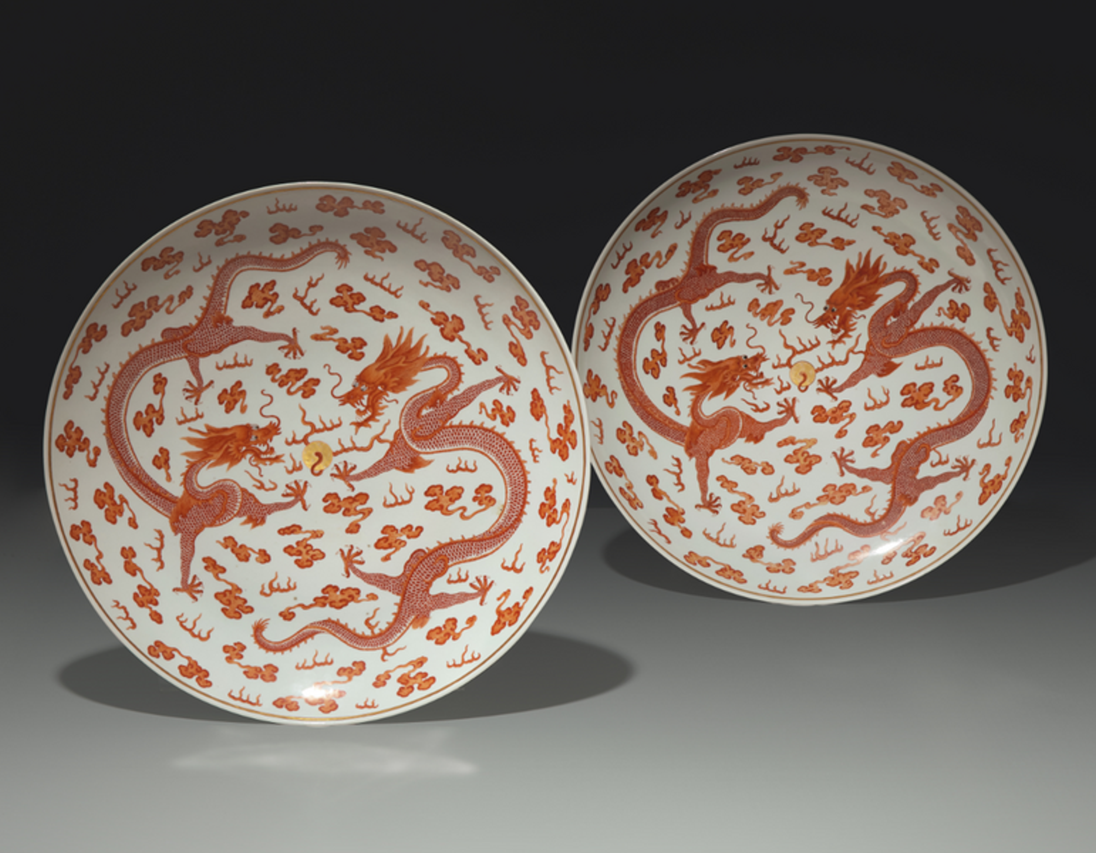 A Pair of Large Chinese Iron-Red Decorated 'Dragons' Chargers, Late Qing Dynasty