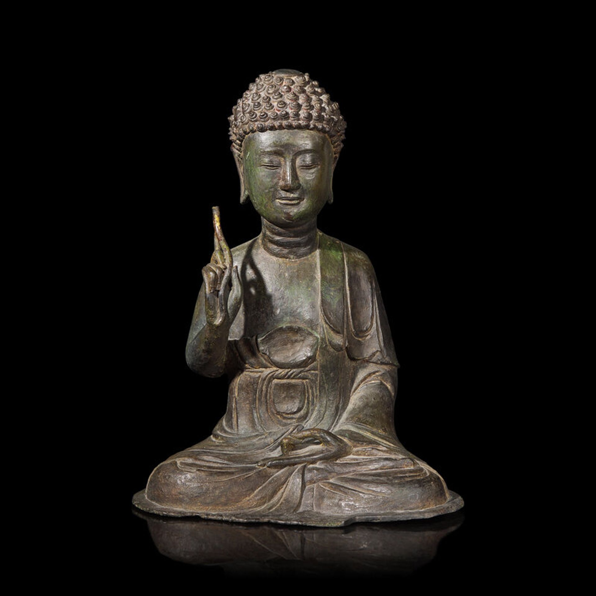 Lot 163 | A Korean Bronze Figure of a Seated Tathagata Buddha, 14th Century, 十四世紀朝鮮王朝 青銅如來坐像 Estimate: $10,000 - 15,000