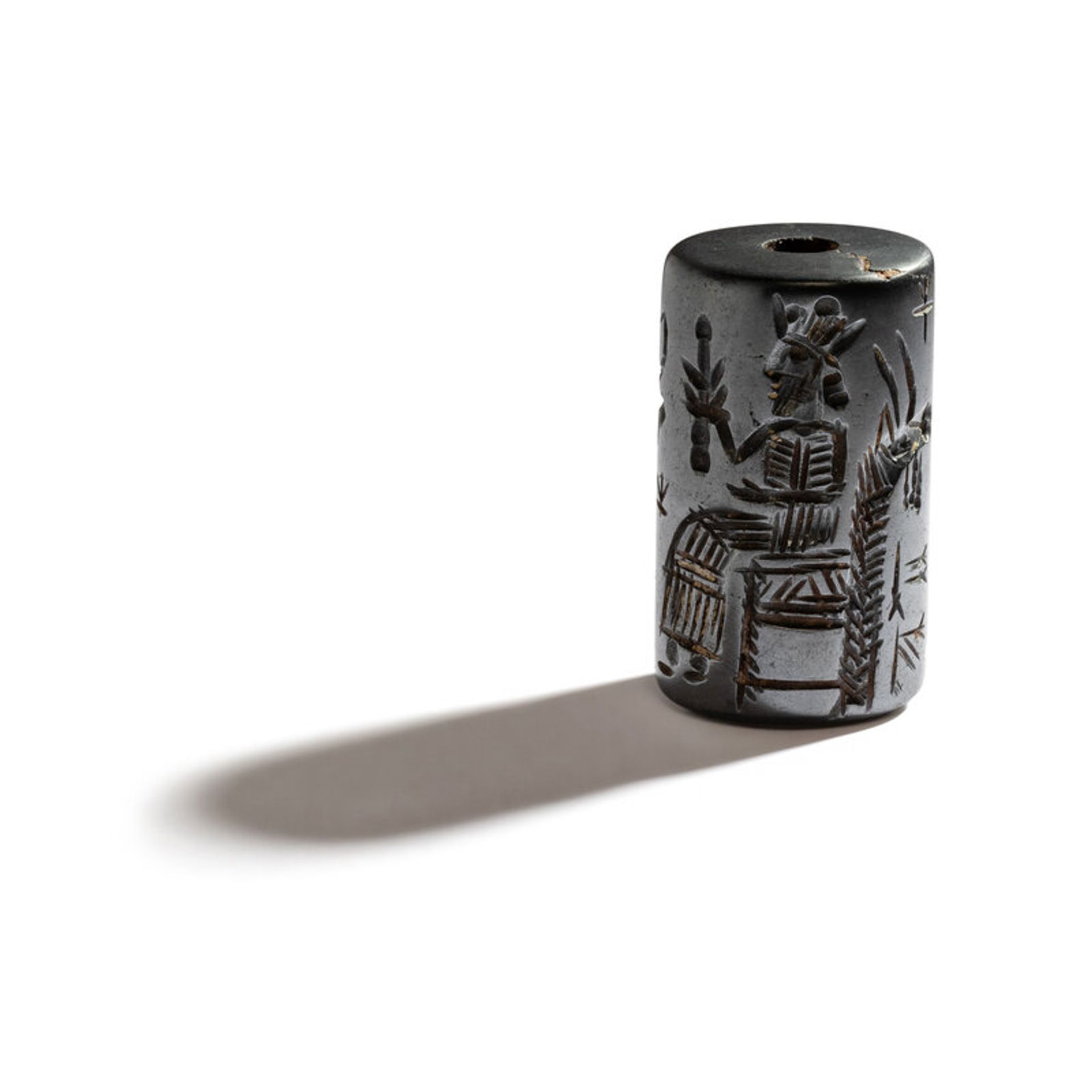 Lot 21 | A Western Asiatic Hematite Cylinder Seal | Estimate: $1,200 - 1,800