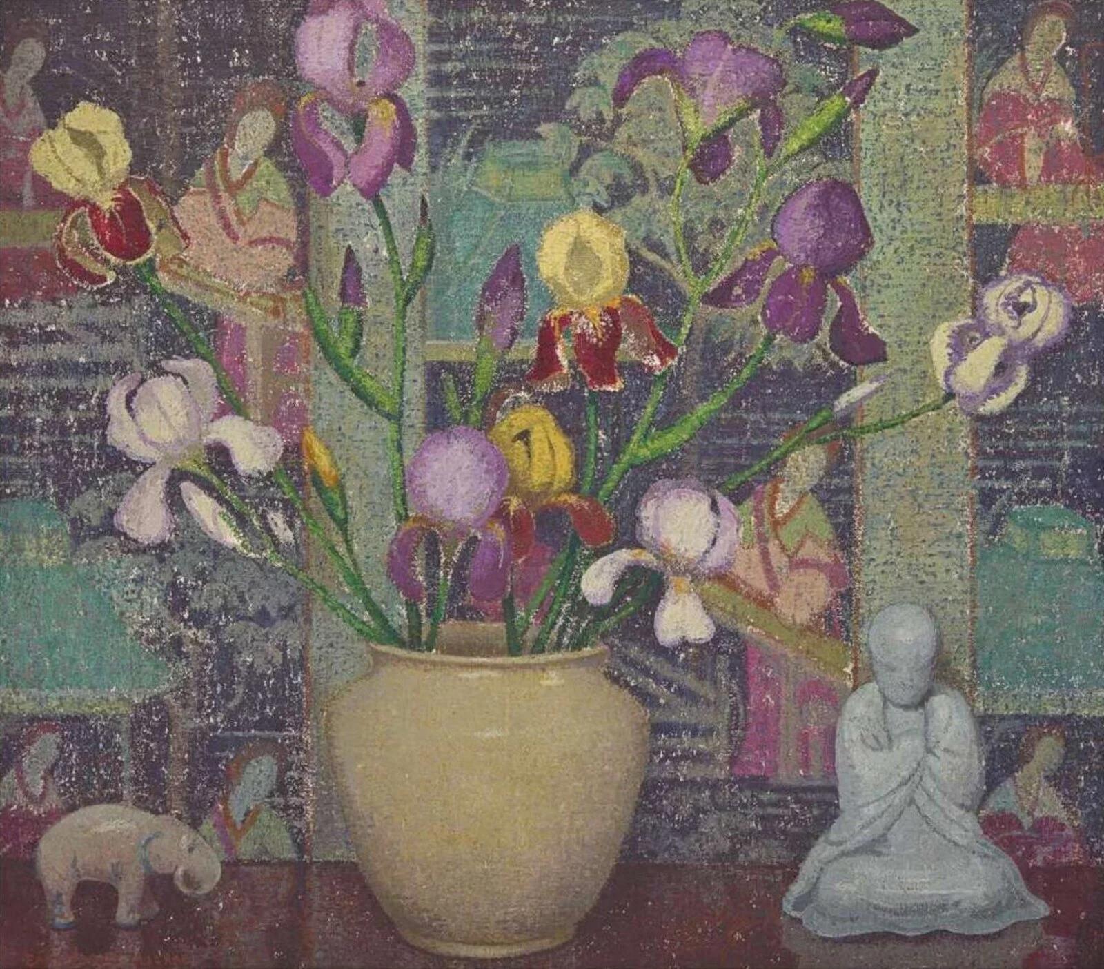 a painting featuring a floral arraignment and small sculptures including an elephant and buddha